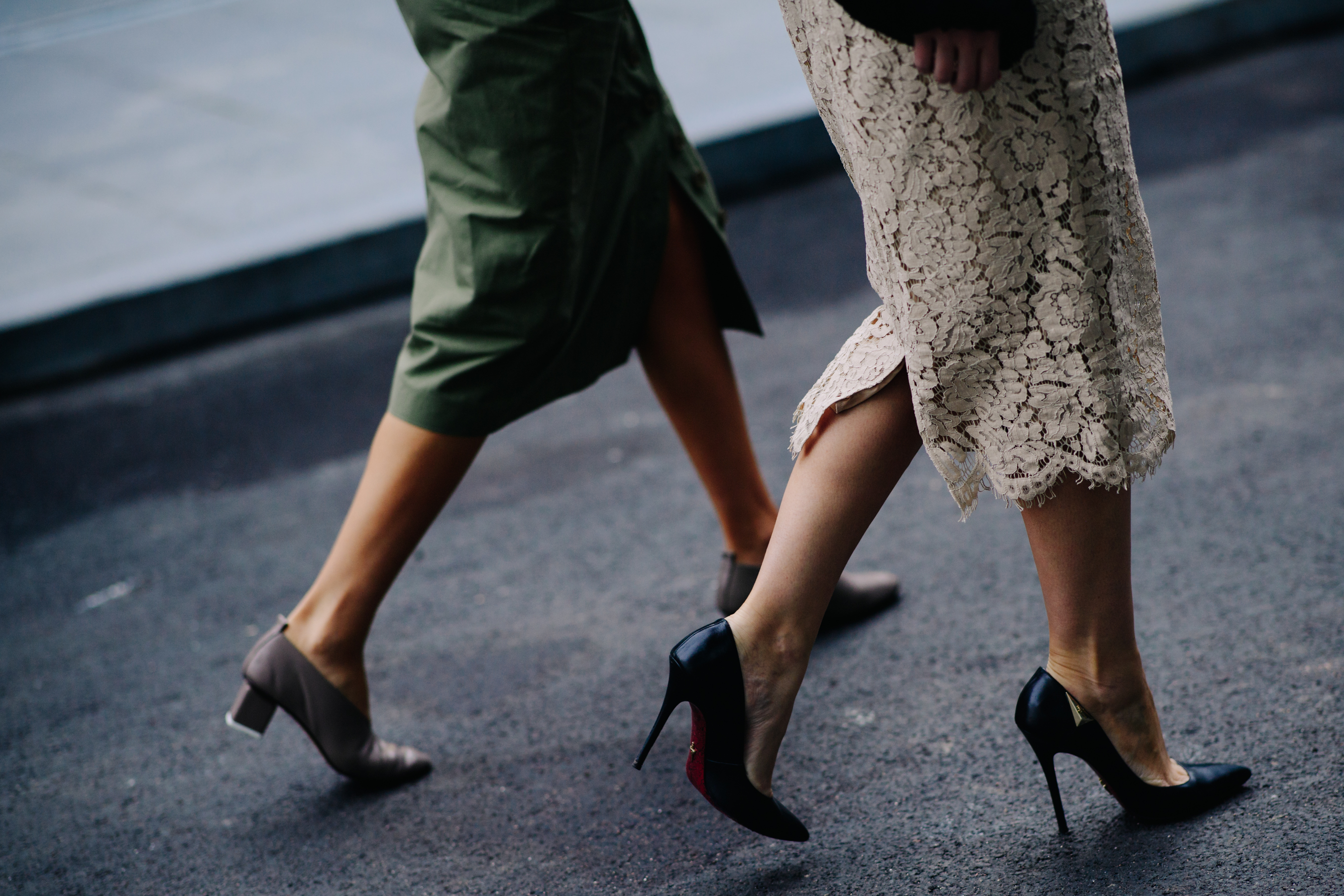 Two women wearing dresses