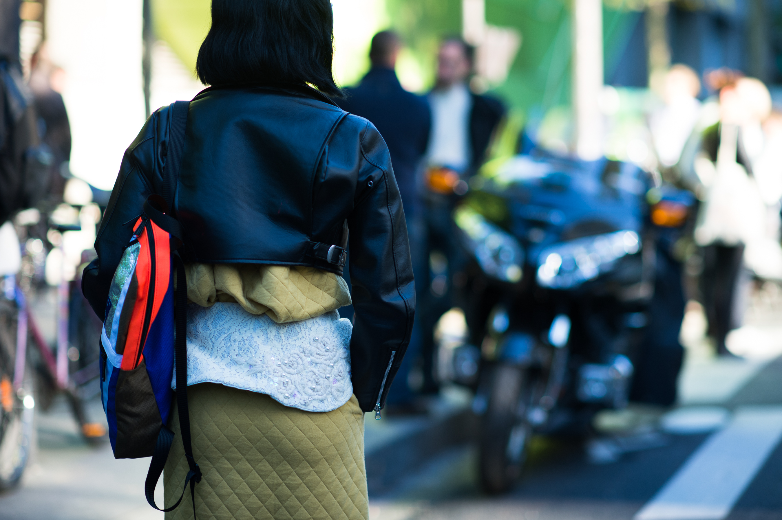 Woman wearing short leather jacket