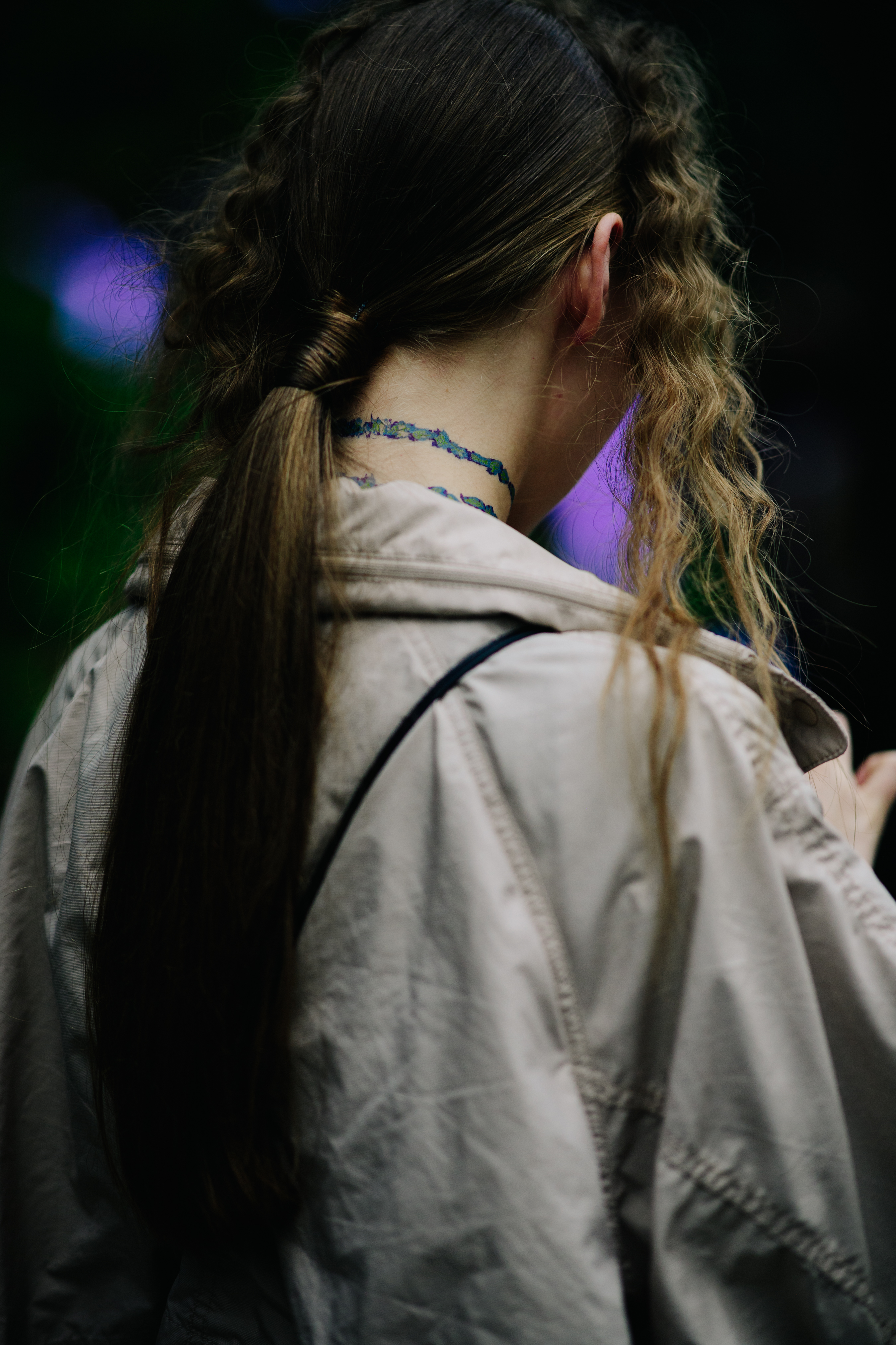 Model with curly hair after a show