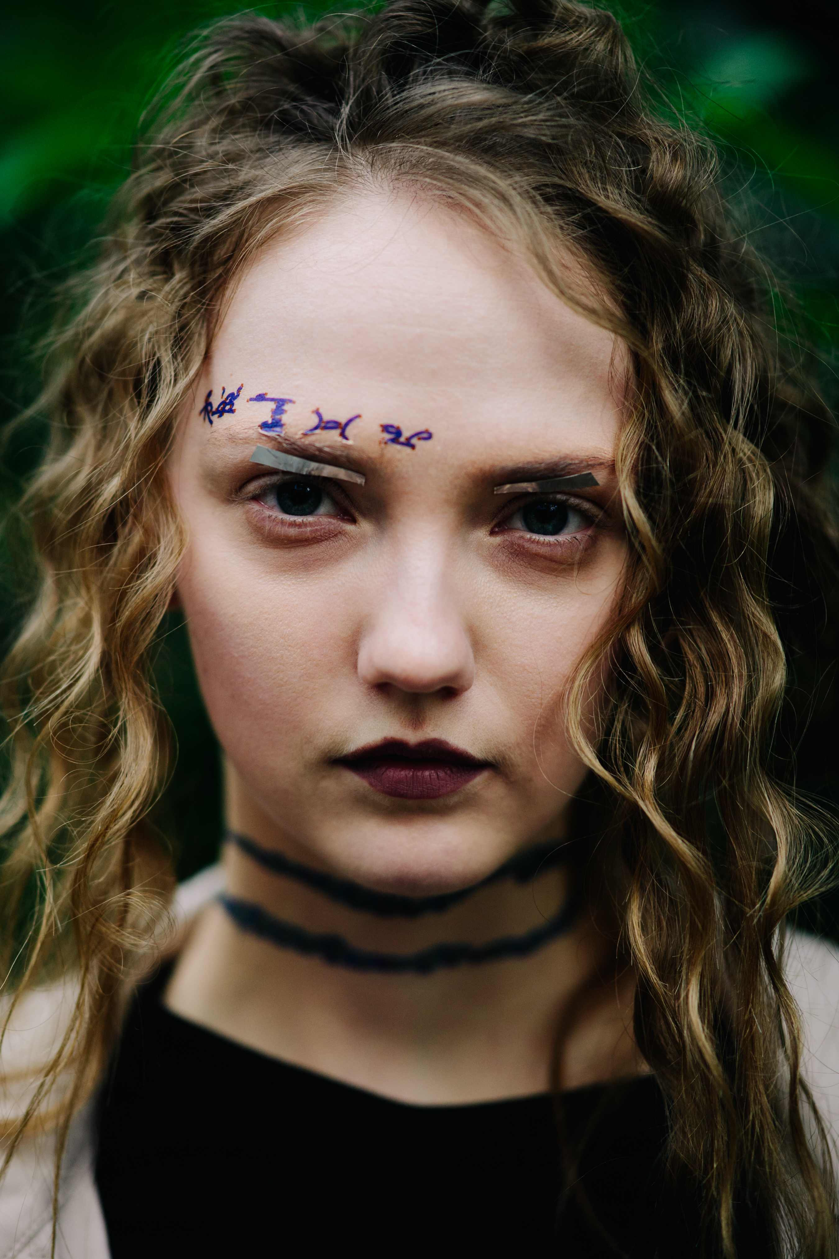 Model with curly hair after a show