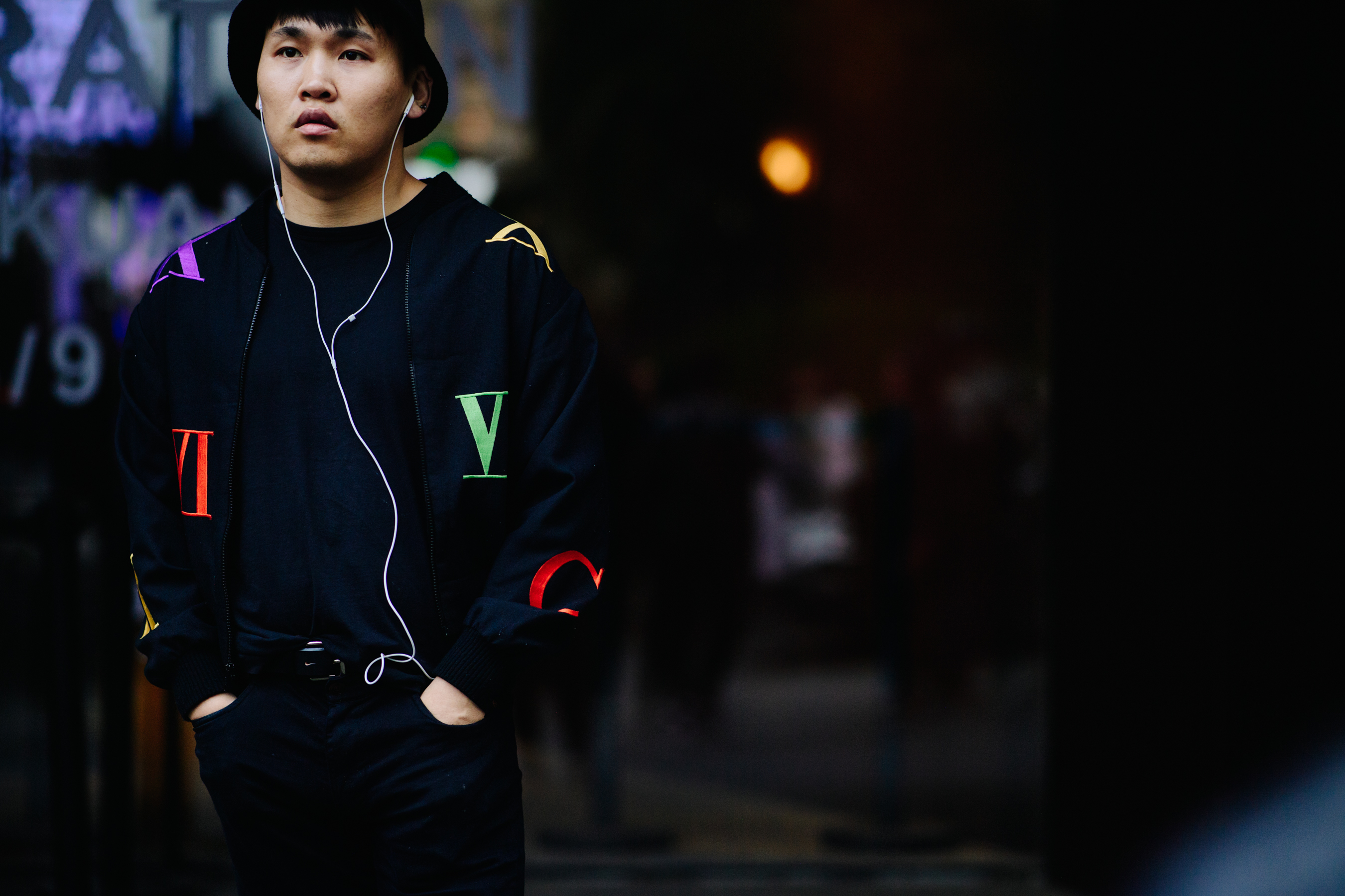 Man wearing graphic bomber