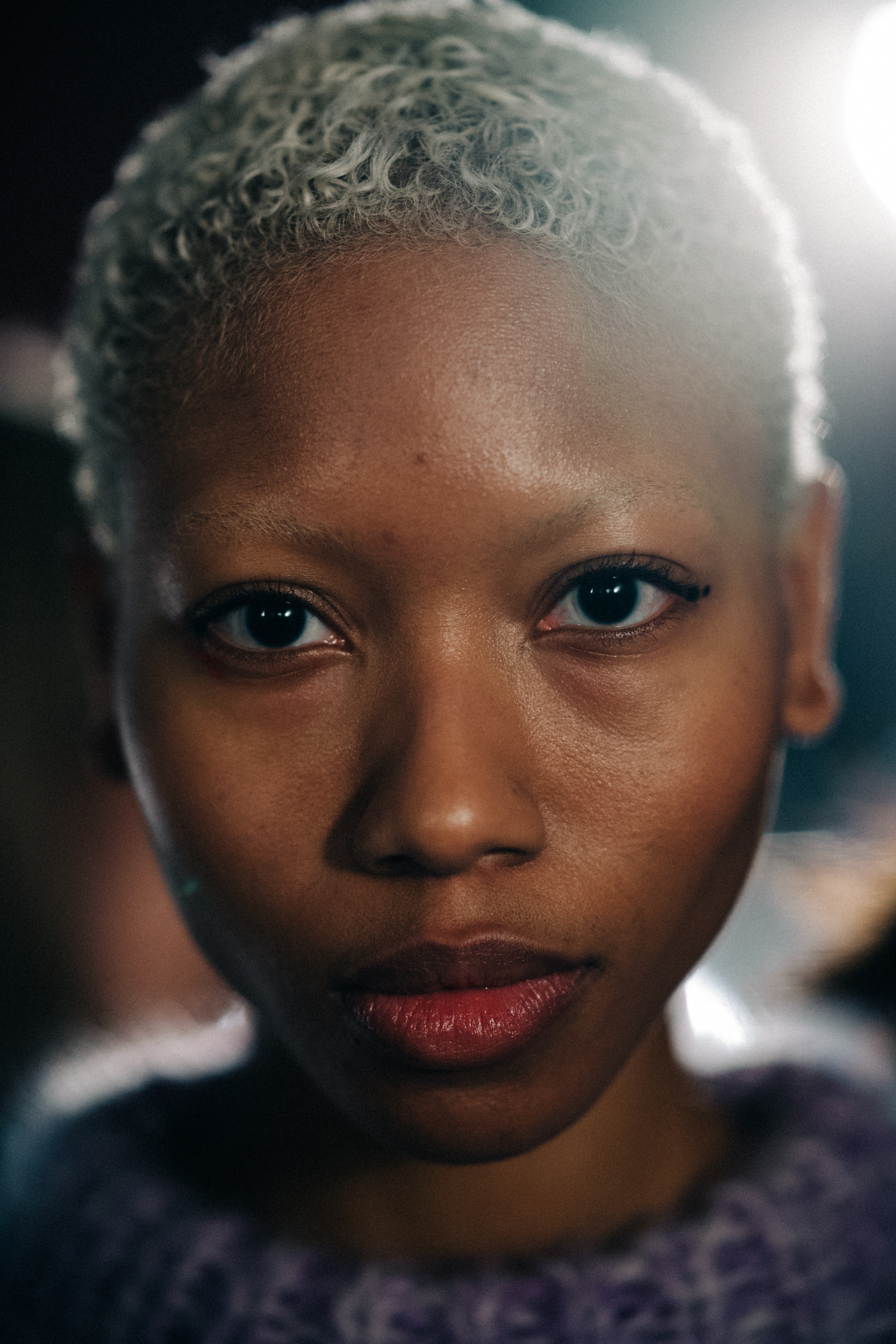 Model with short white hair