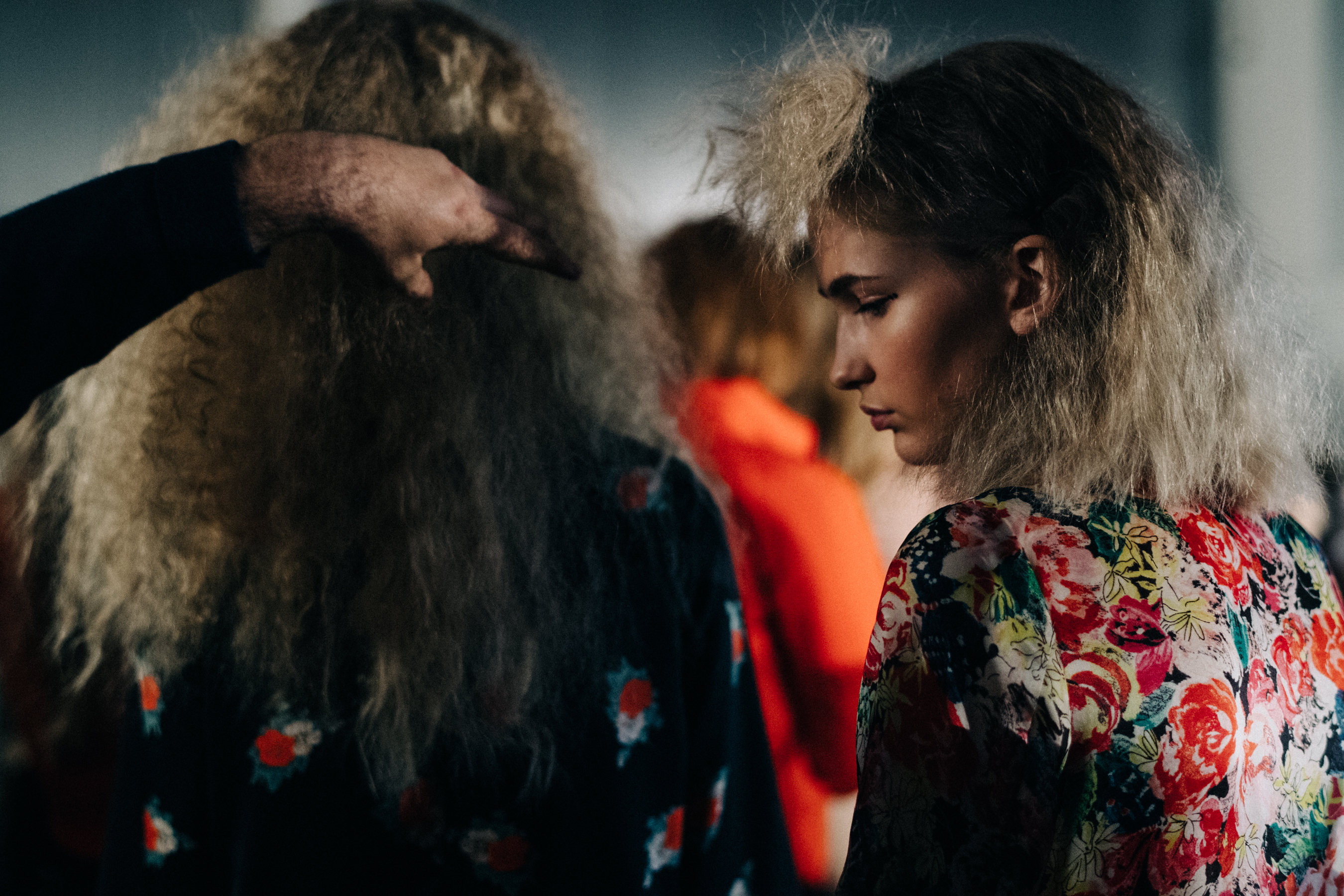 Two models with curly hair