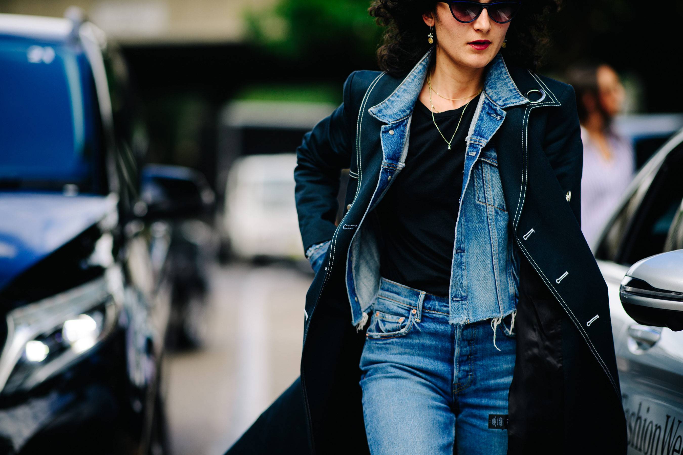 Woman wearing a black stitched coat