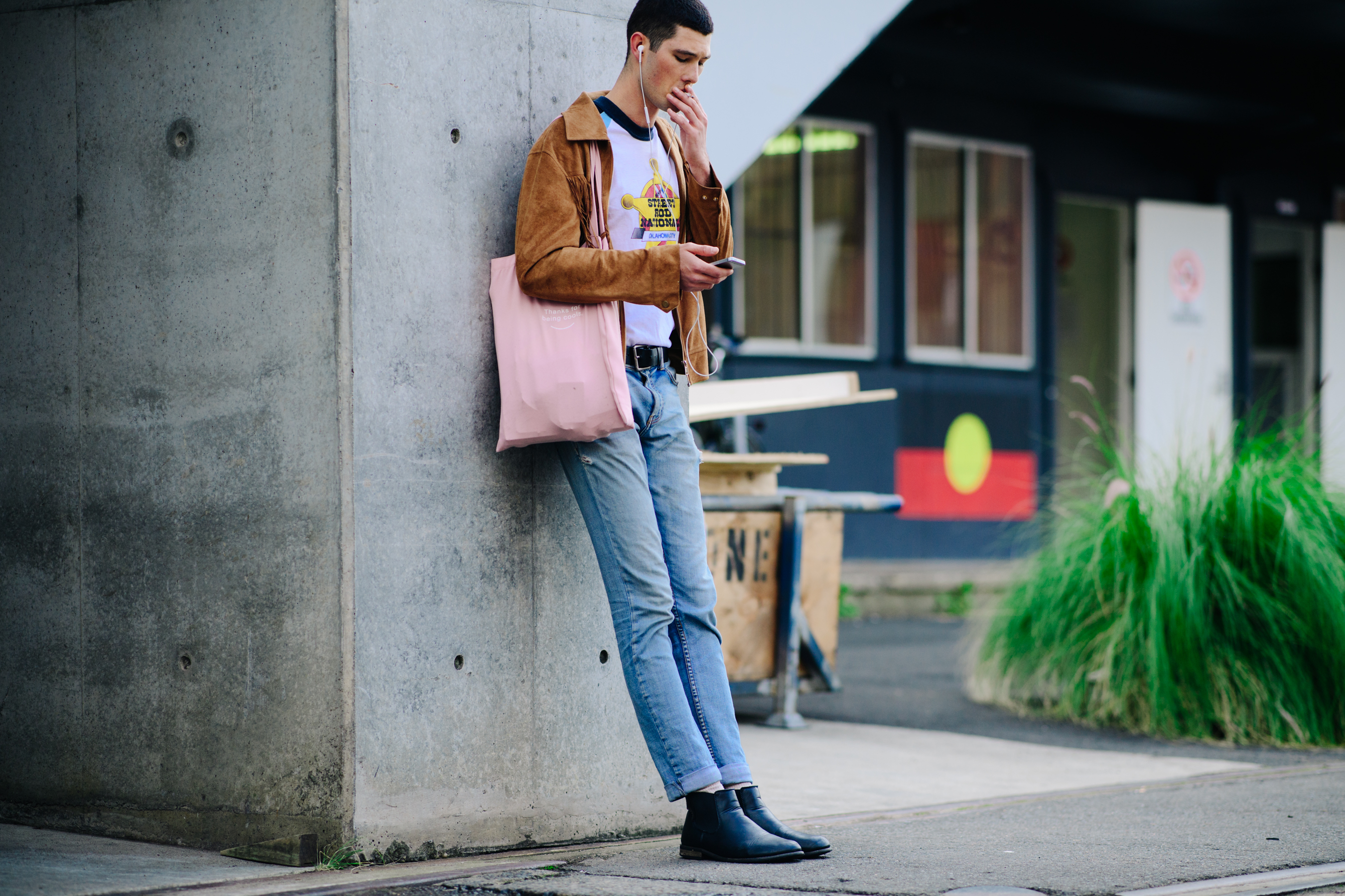 Male model smoking before a show