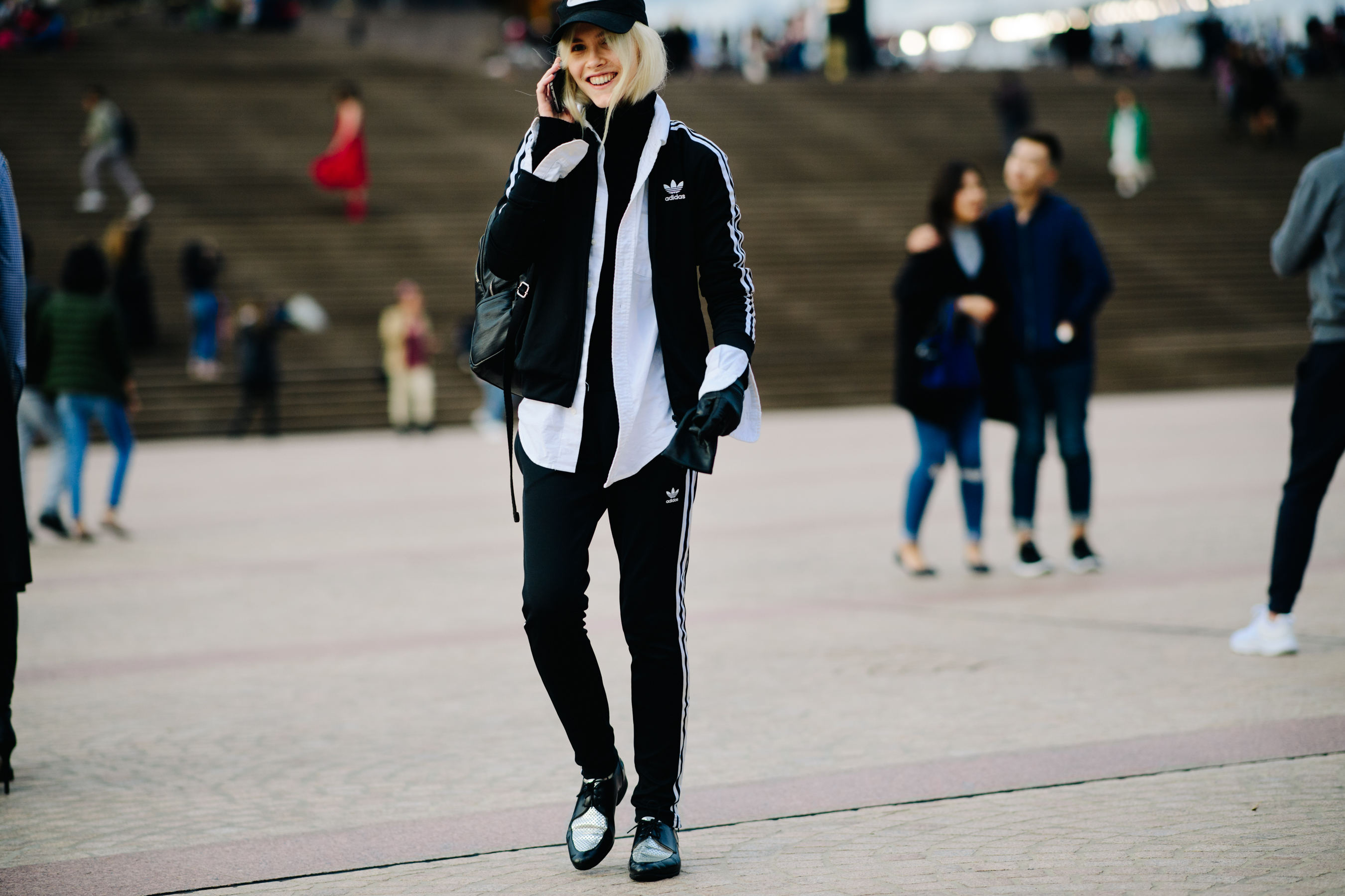Model wearing Adidas tracksuit
