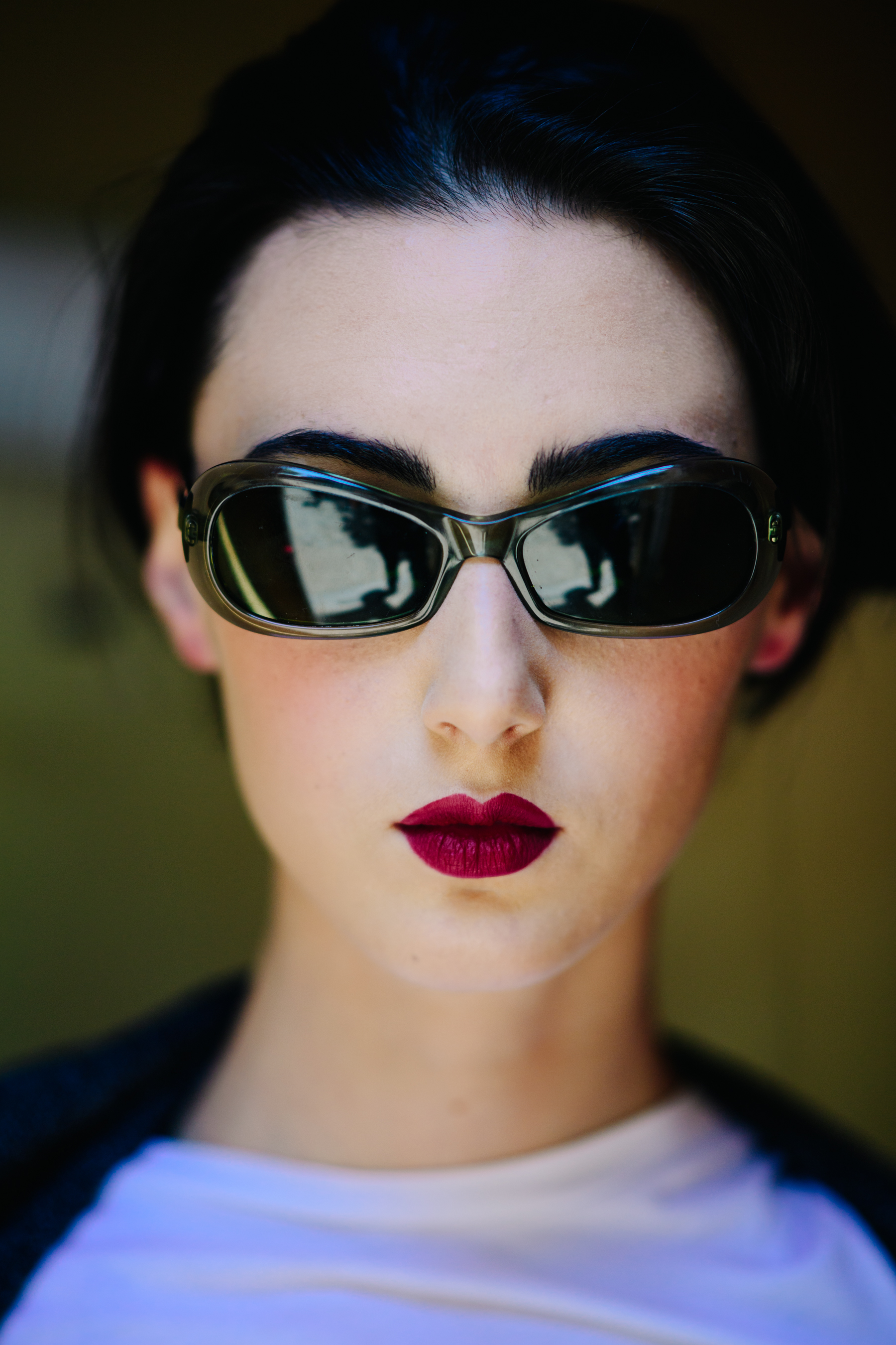 Young girl wearing retro sunglasses