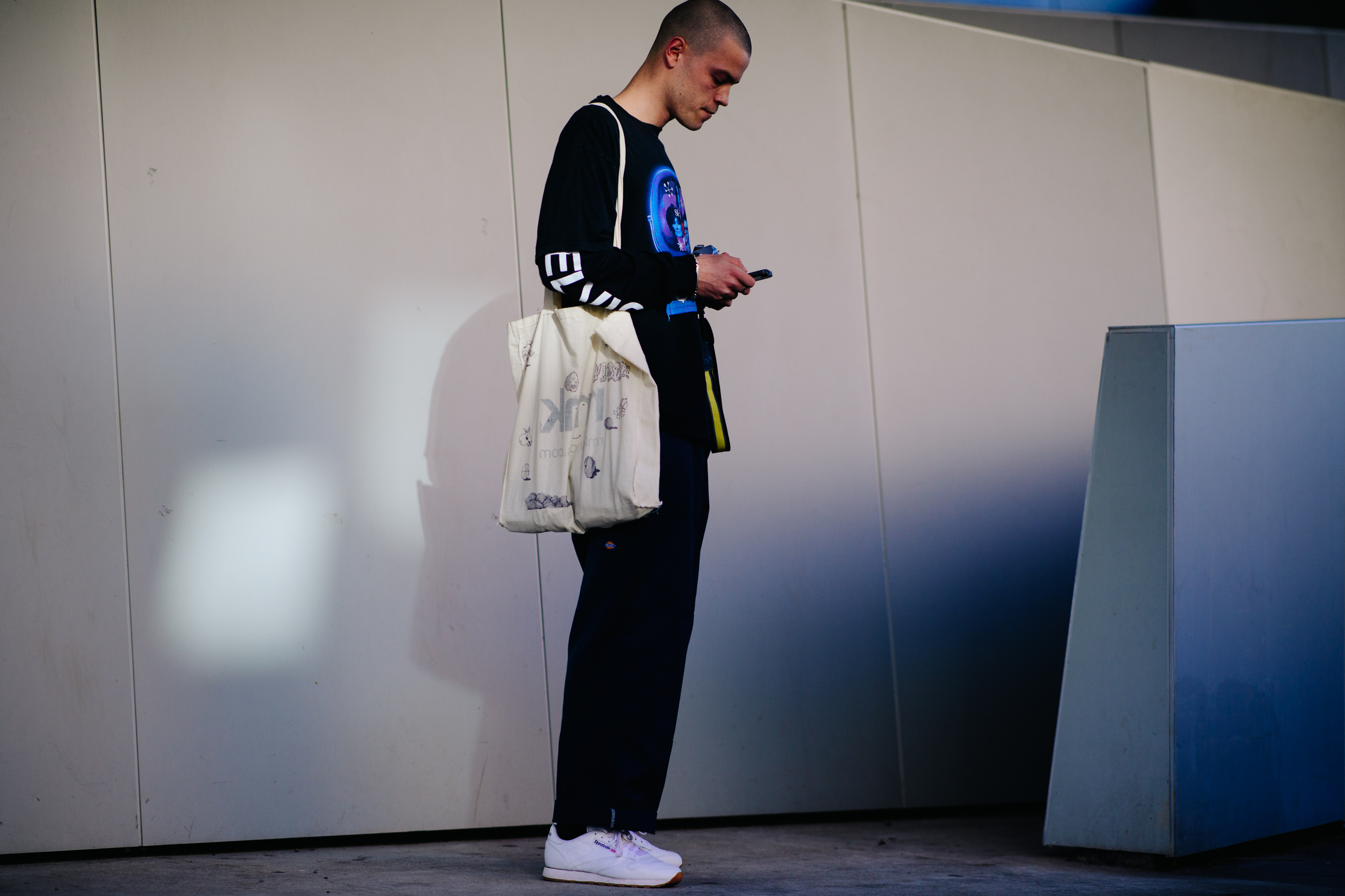 Man with tote bag