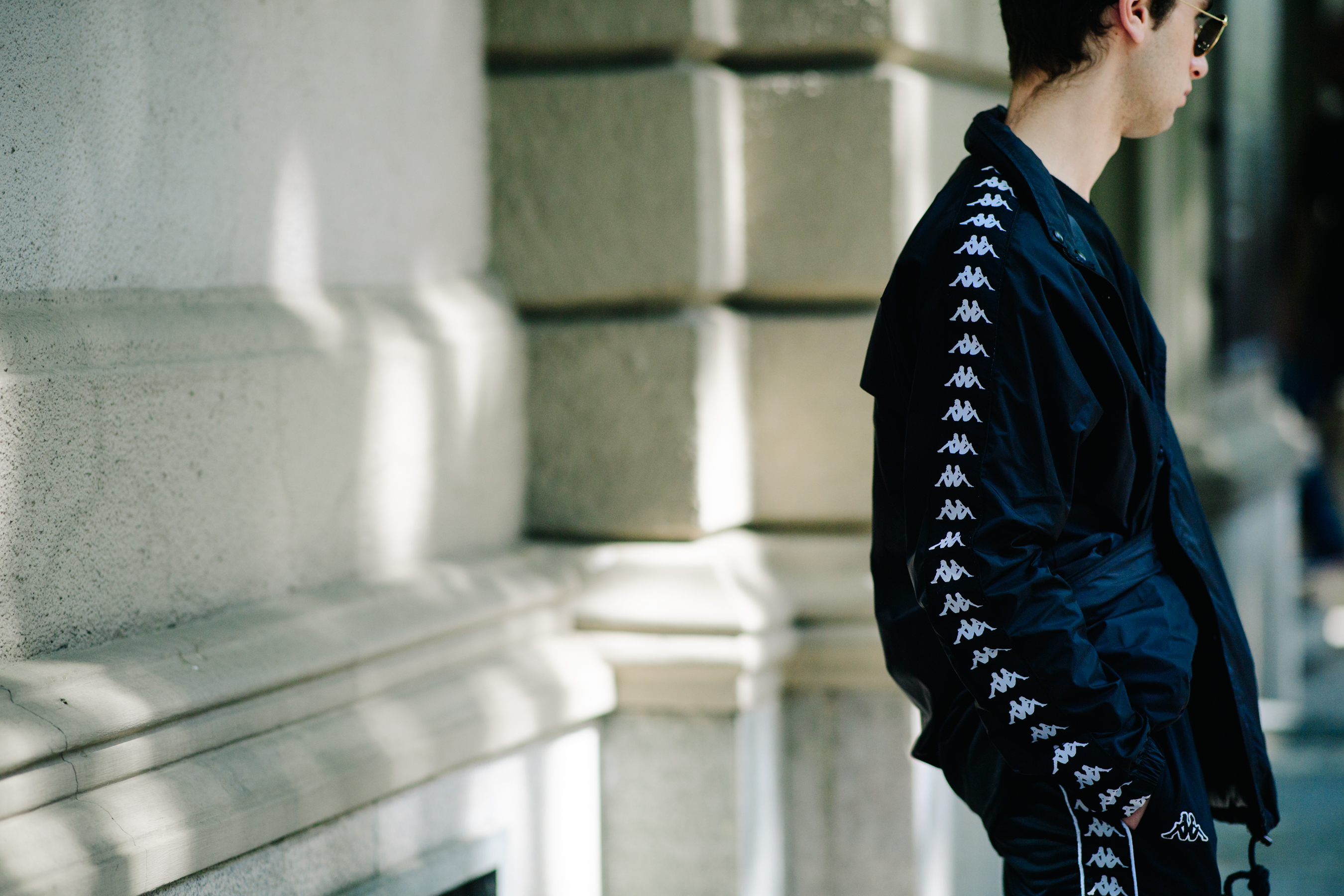 Boy wearing black tracking pants