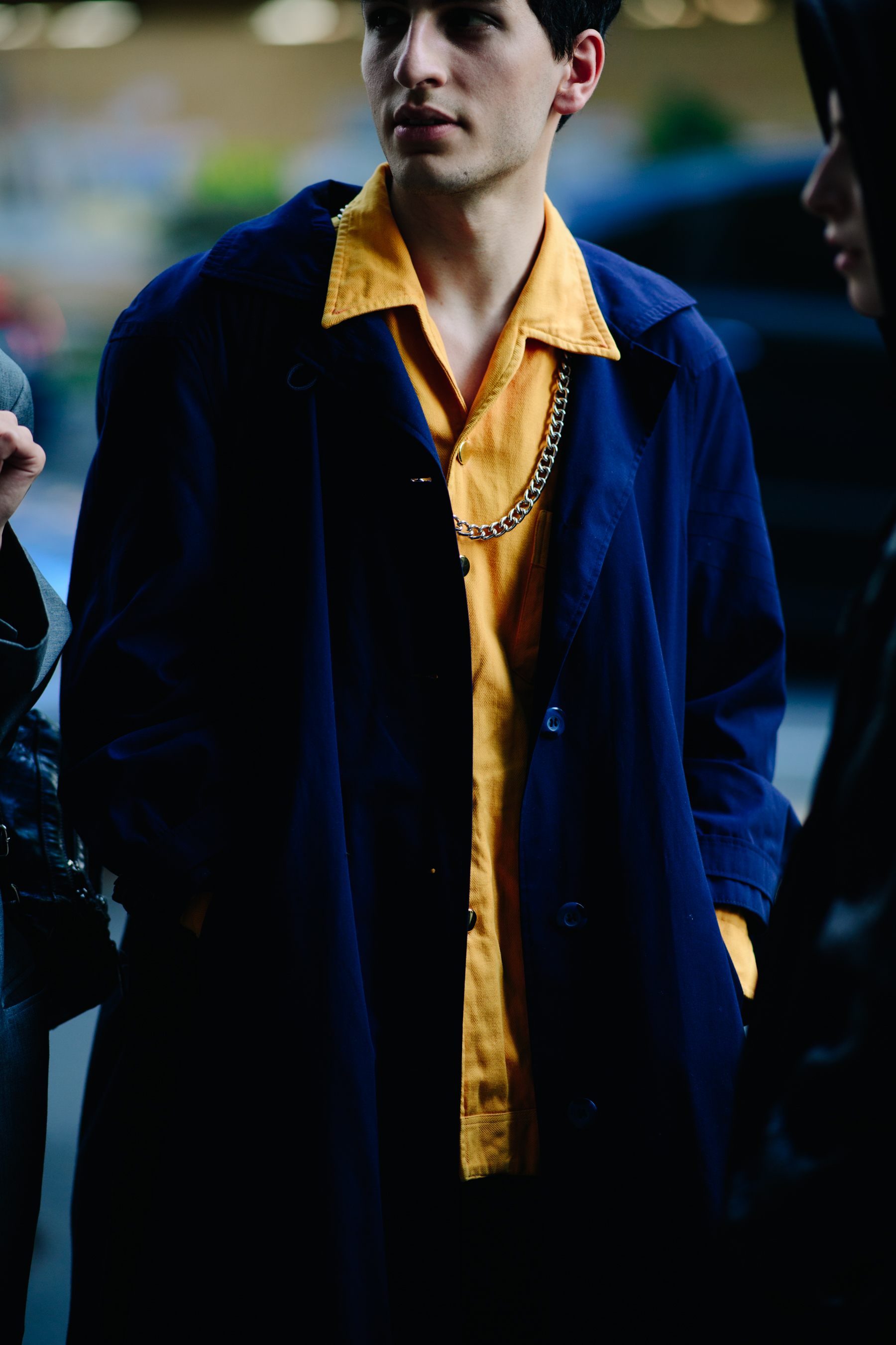 Boy wearing a chunky metal chain