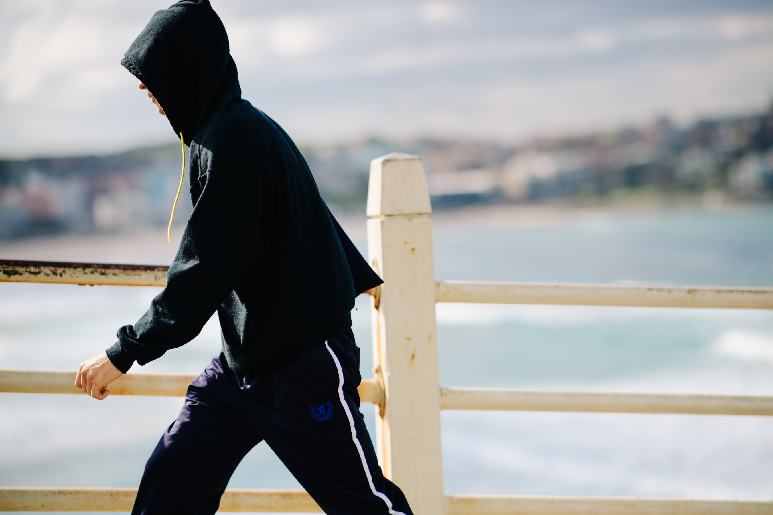 Male model wearing a black hoodie