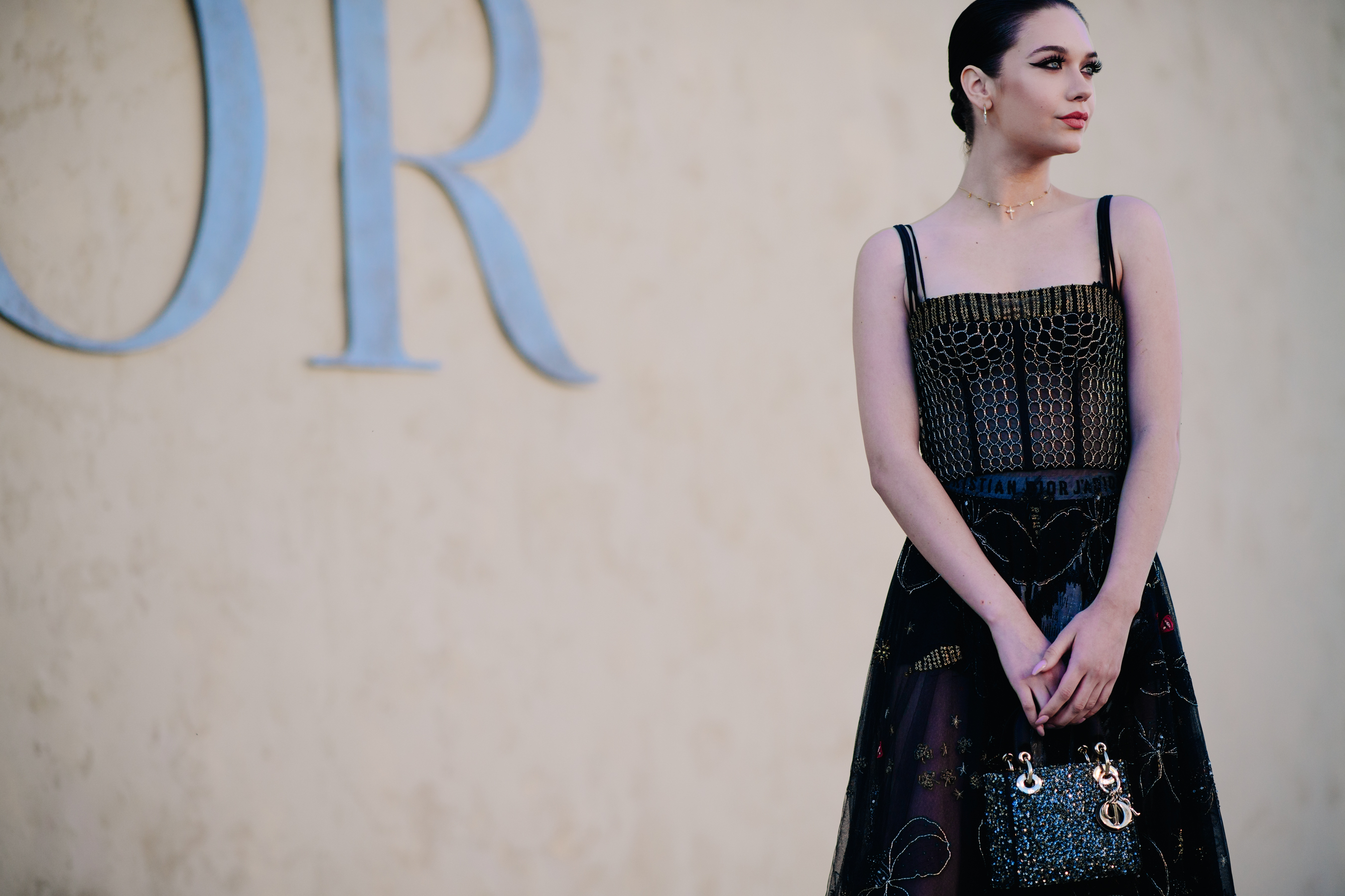 Girl wearing a black organza dress