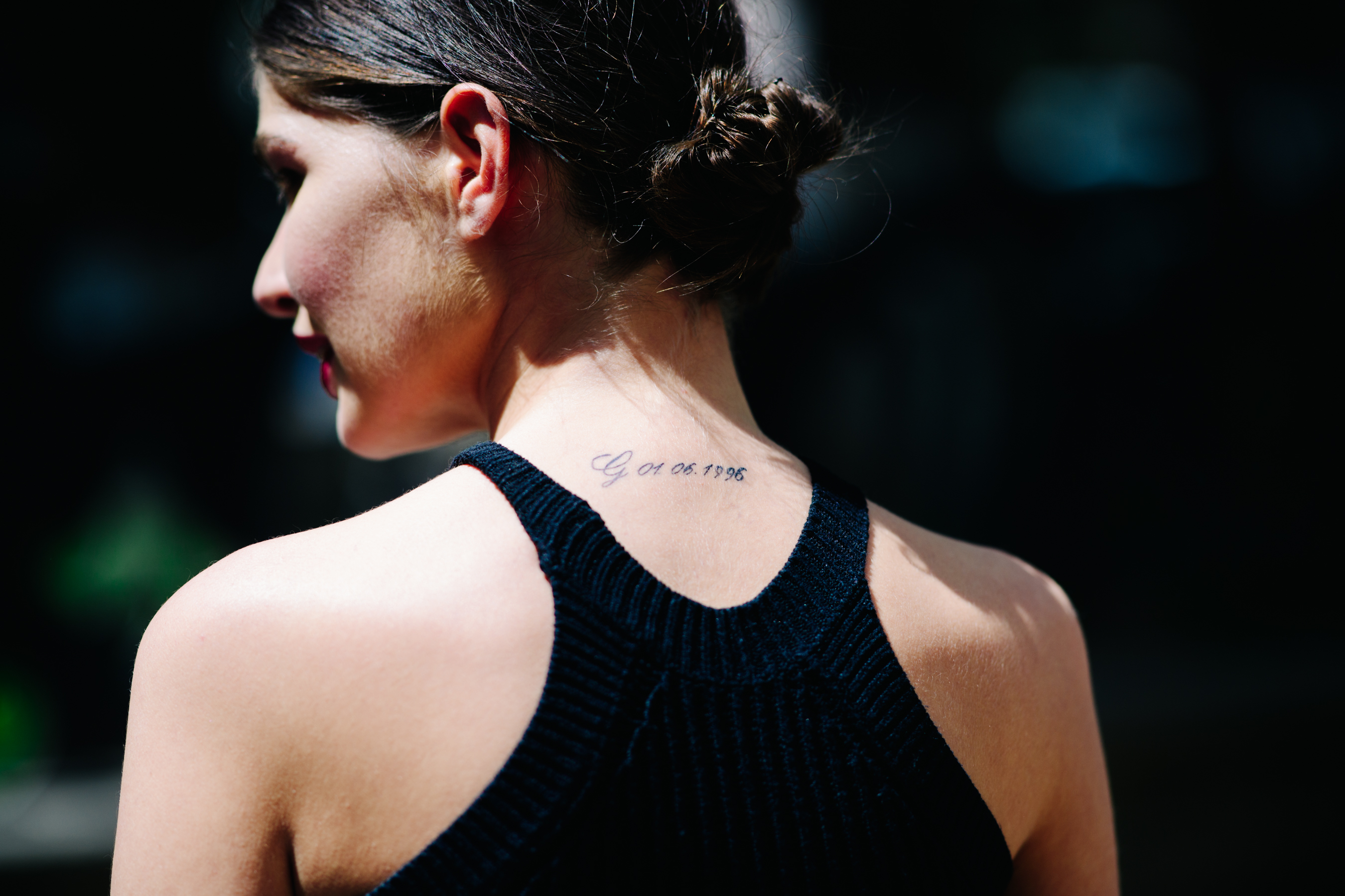 Girl with a minimalistic back tattoo
