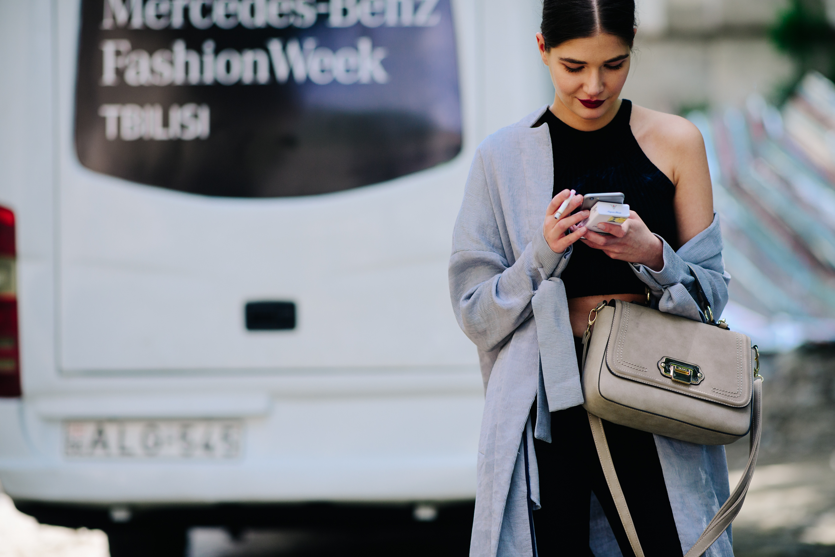 Girl wearing a grey deconstructed coat