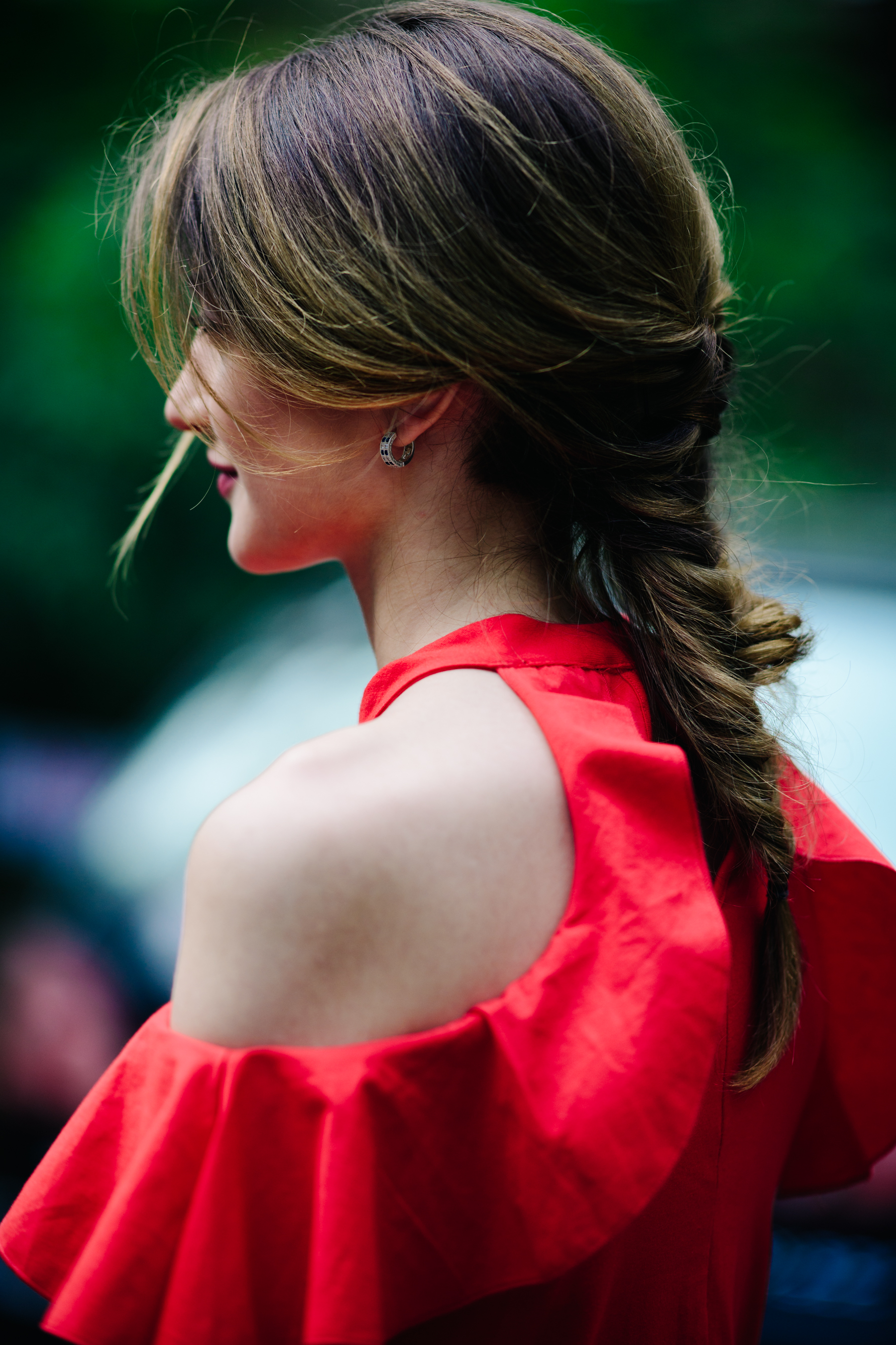Girl wearing a red organza top