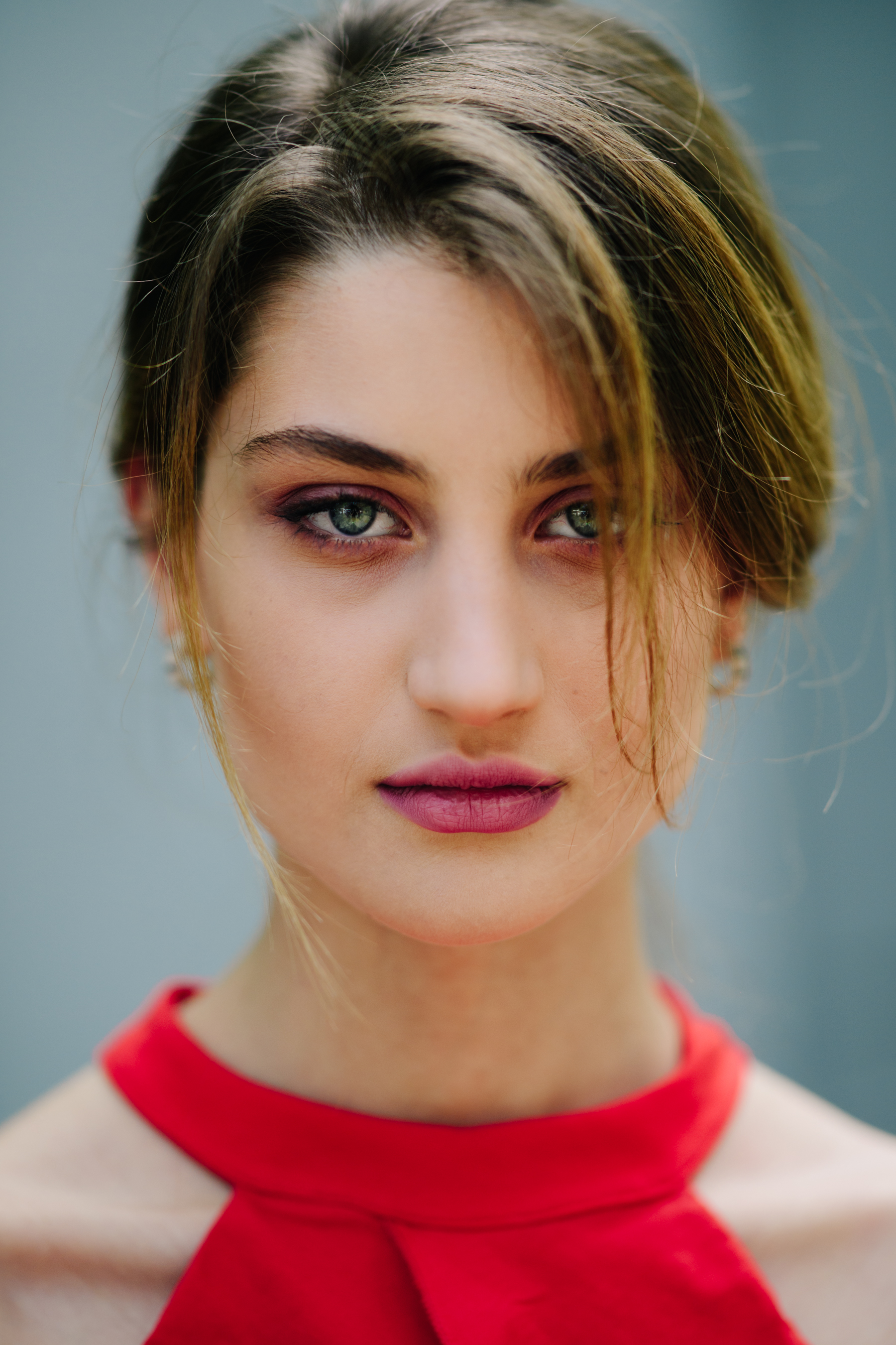 Young female model wearing a red top