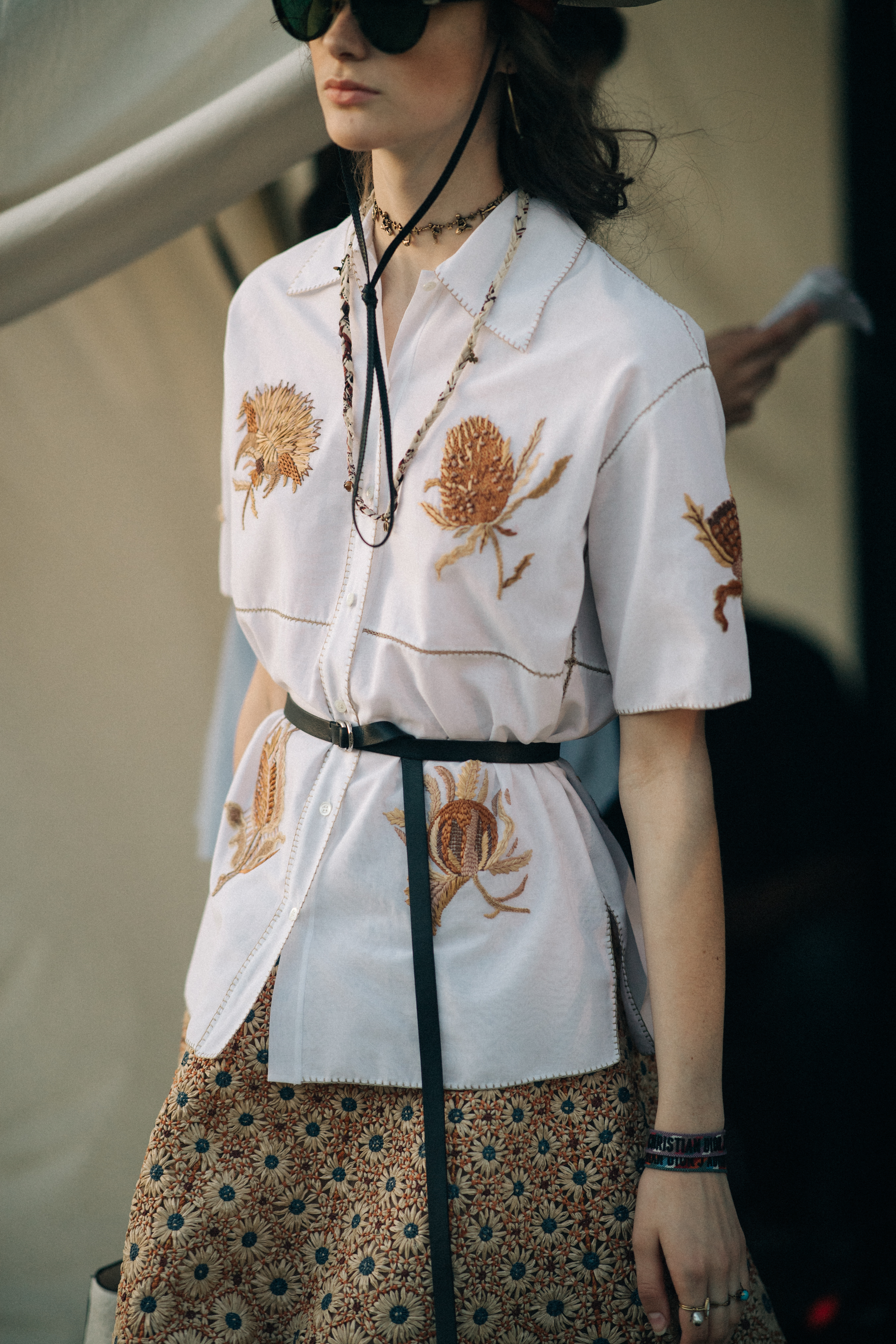 Girl wearing an embroidered white shirt