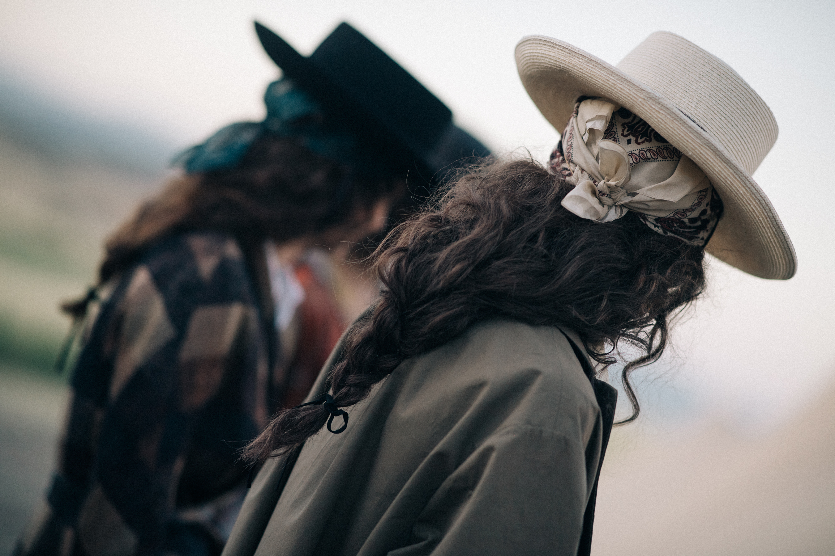 Female model wearing a white hat
