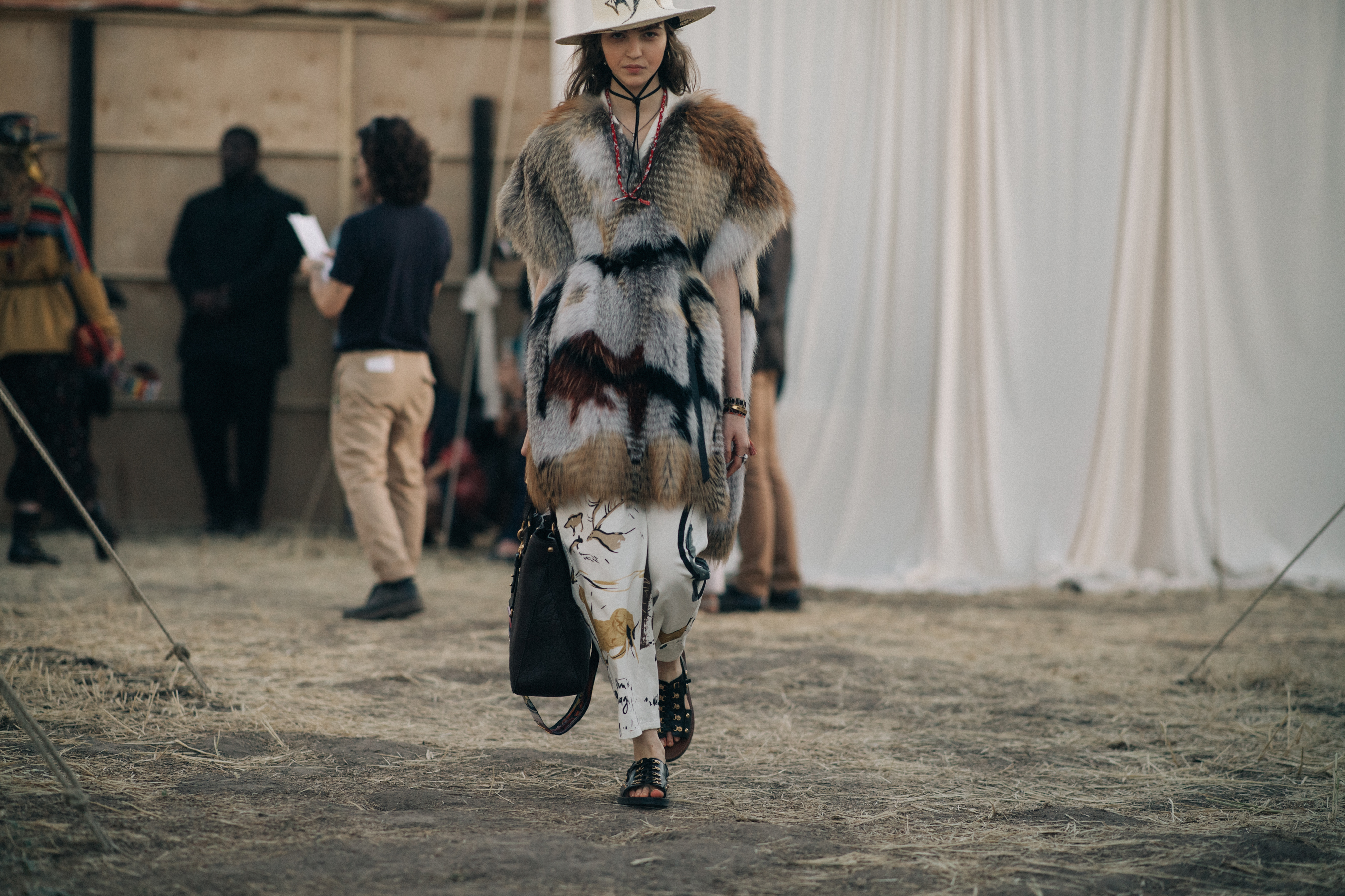 Model wearing a gradient fur poncho