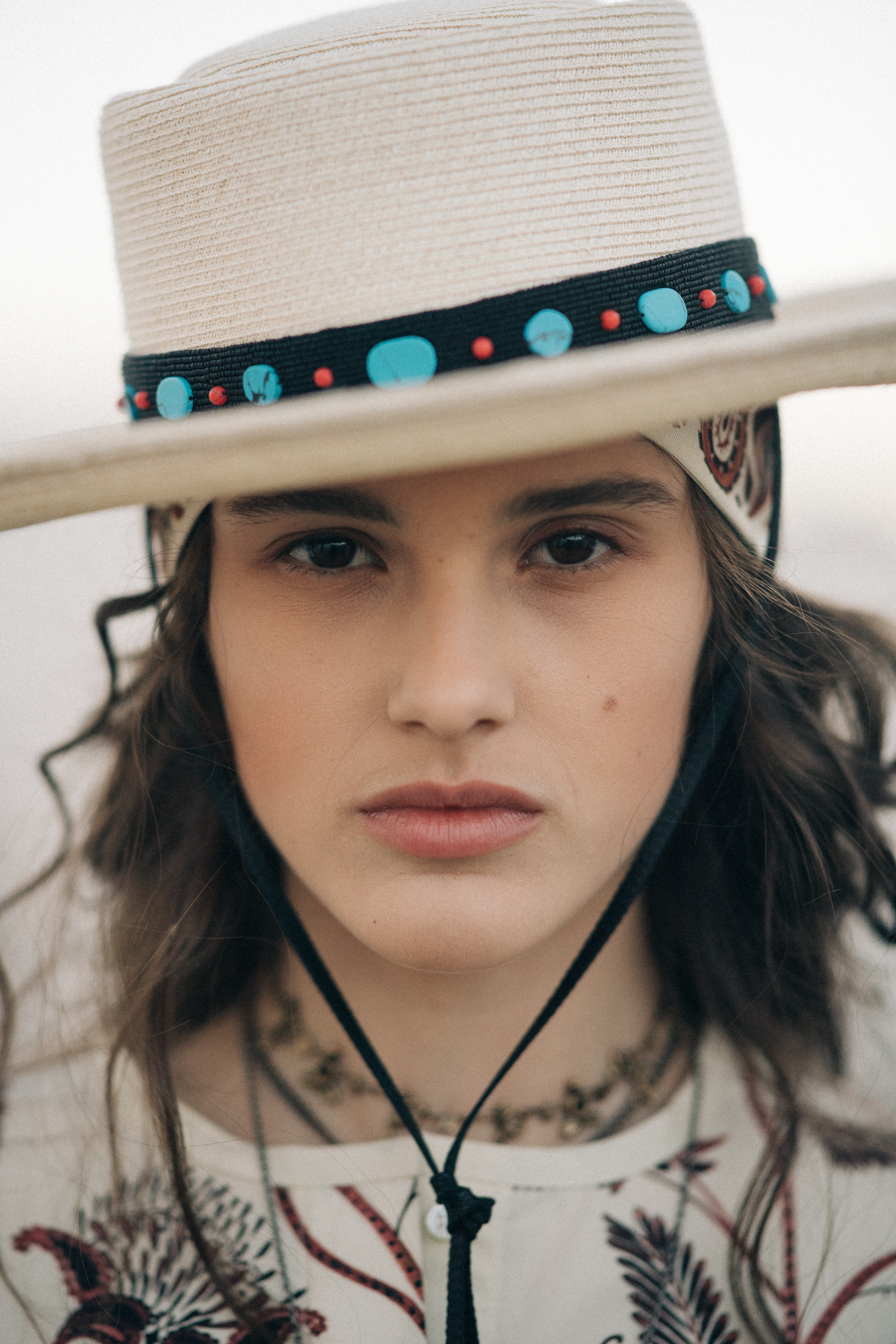 Portrait of a girl wearing white hat