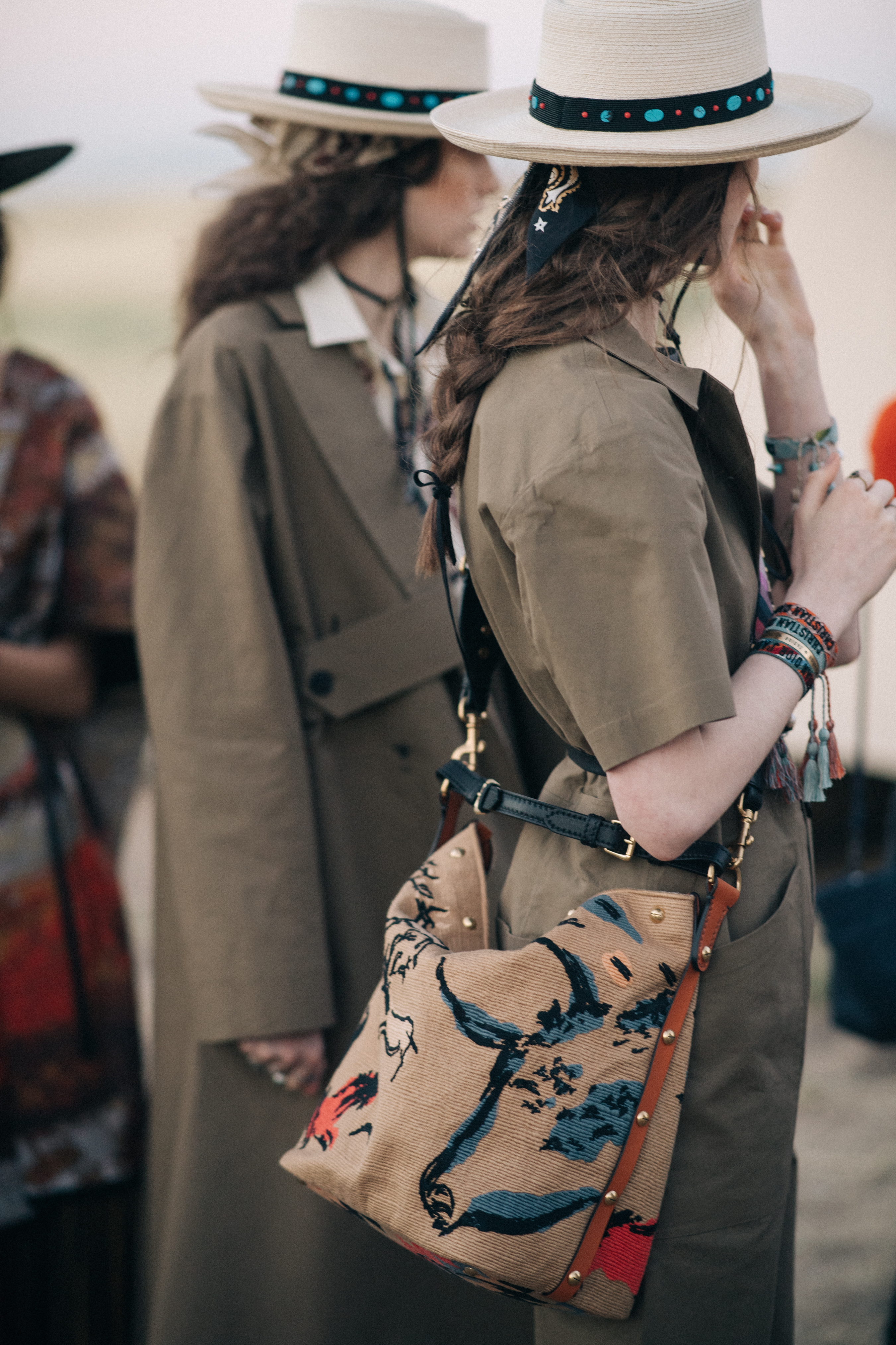 Girl carrying a brown straw bag