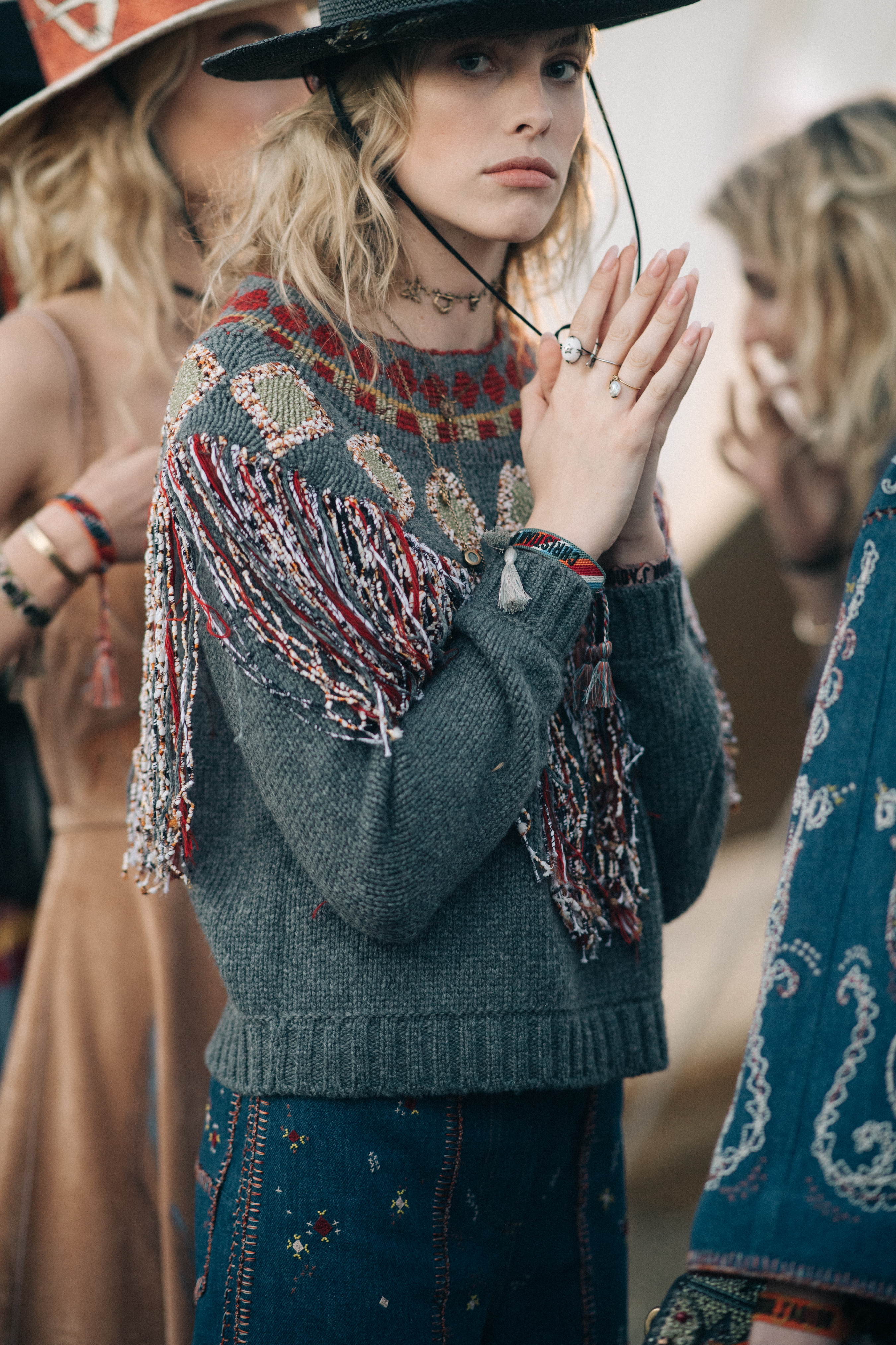 Girl wearing a distressed green jacket