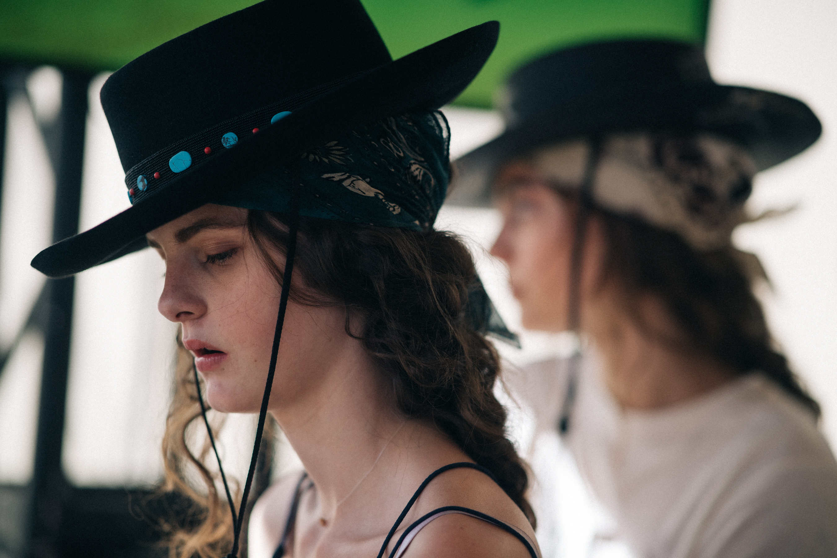 Girl wearing a black hat with details