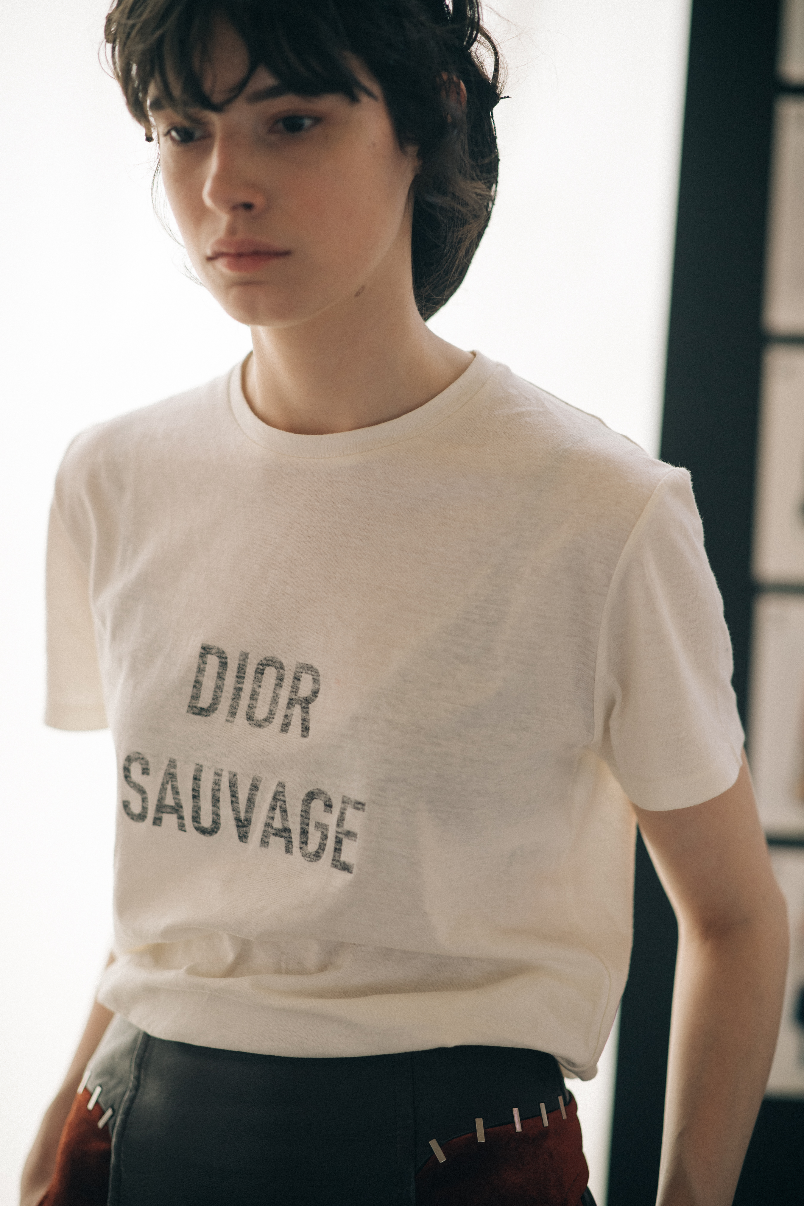 Girl wearing a Dior t-shirt