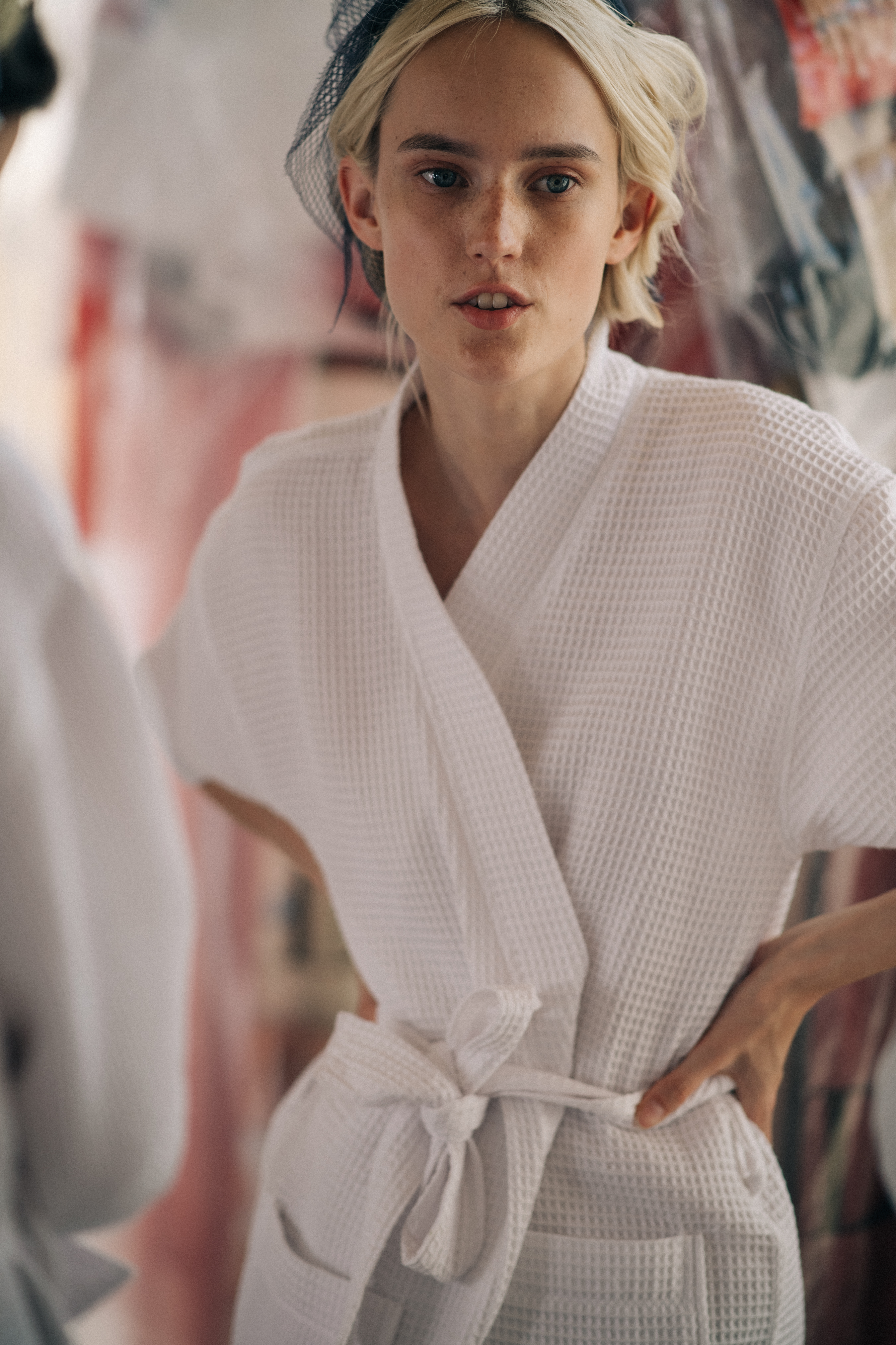 Female model relaxing on the backstage