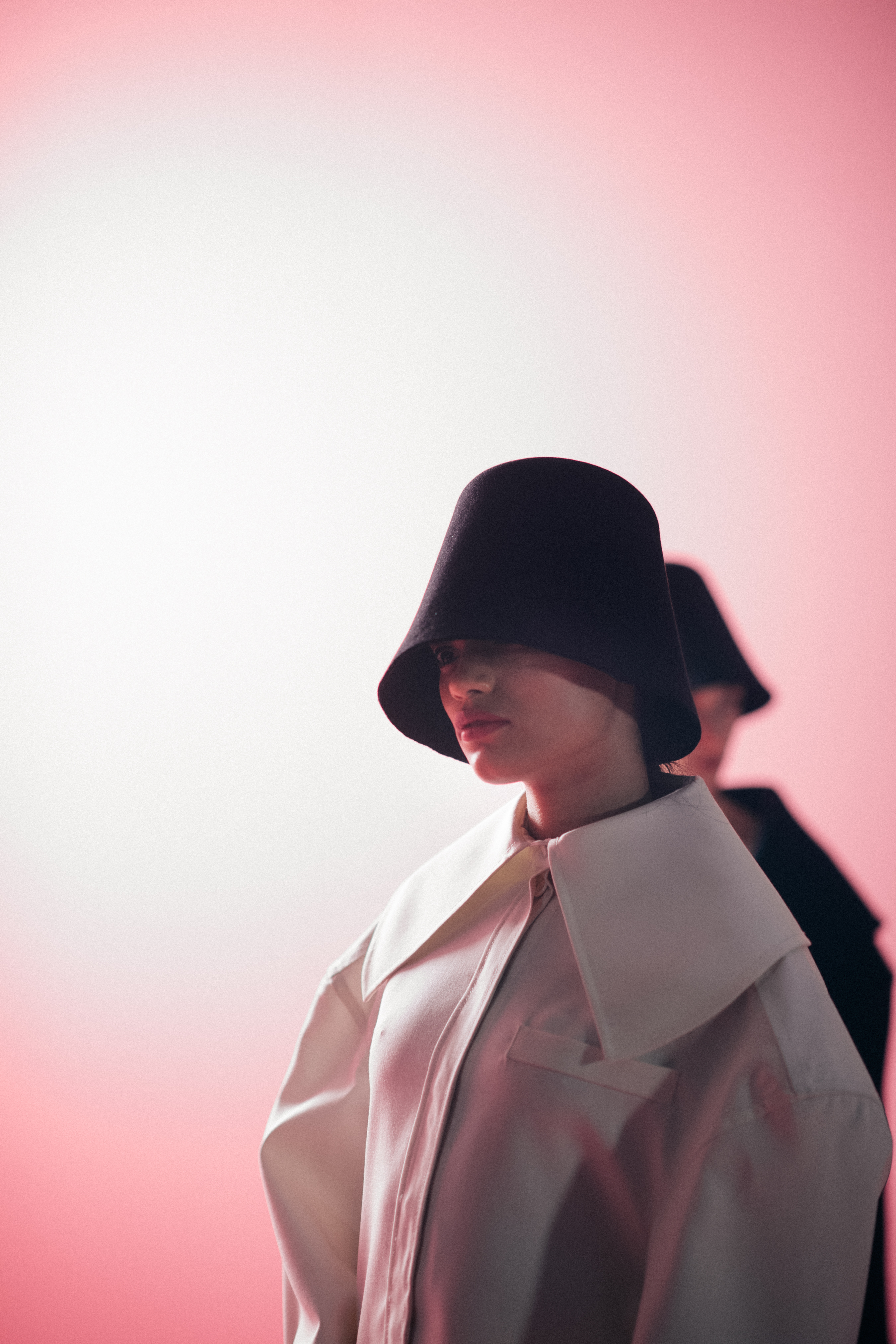 Woman wearing a black bell hat