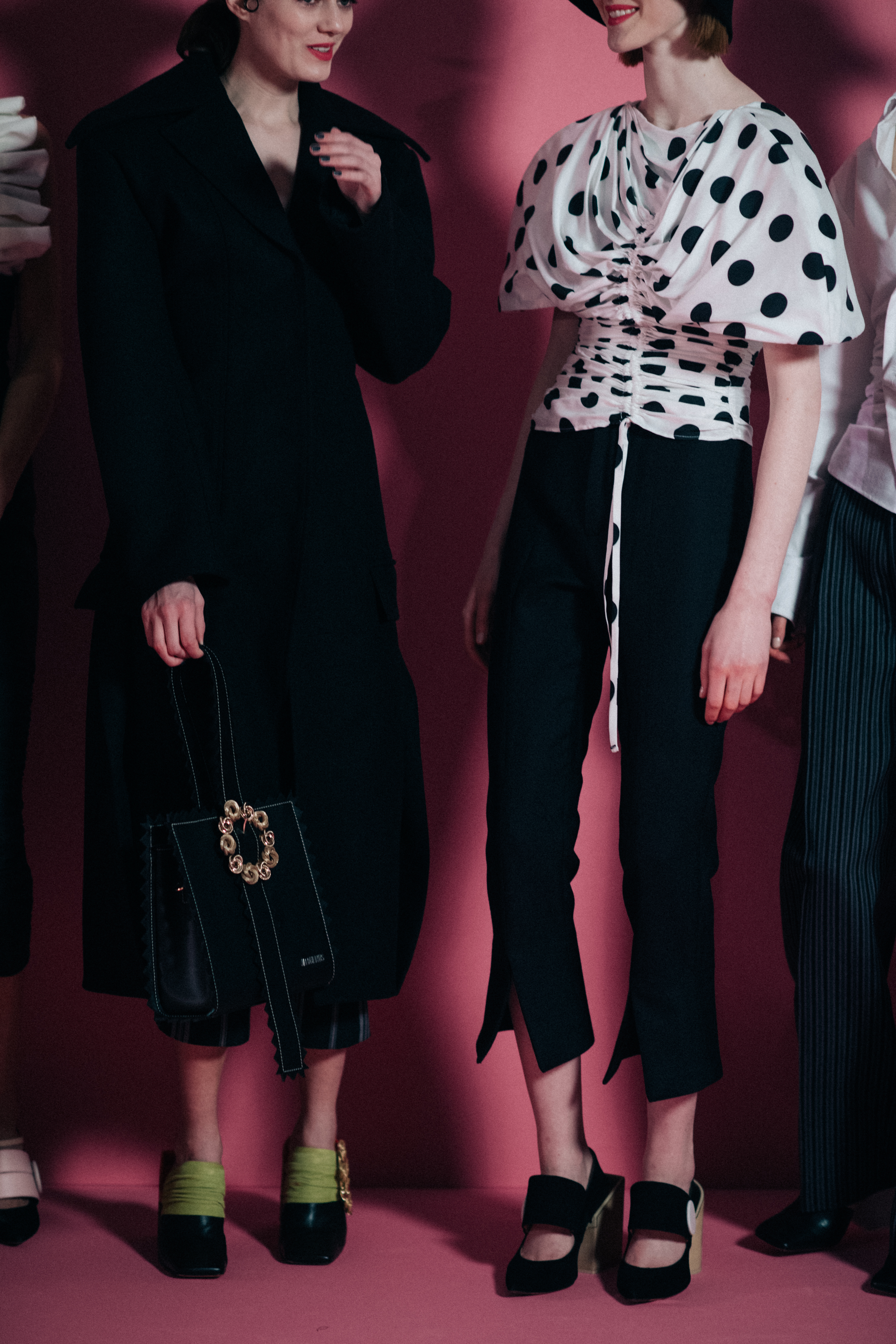 Girl holding a black leather bag