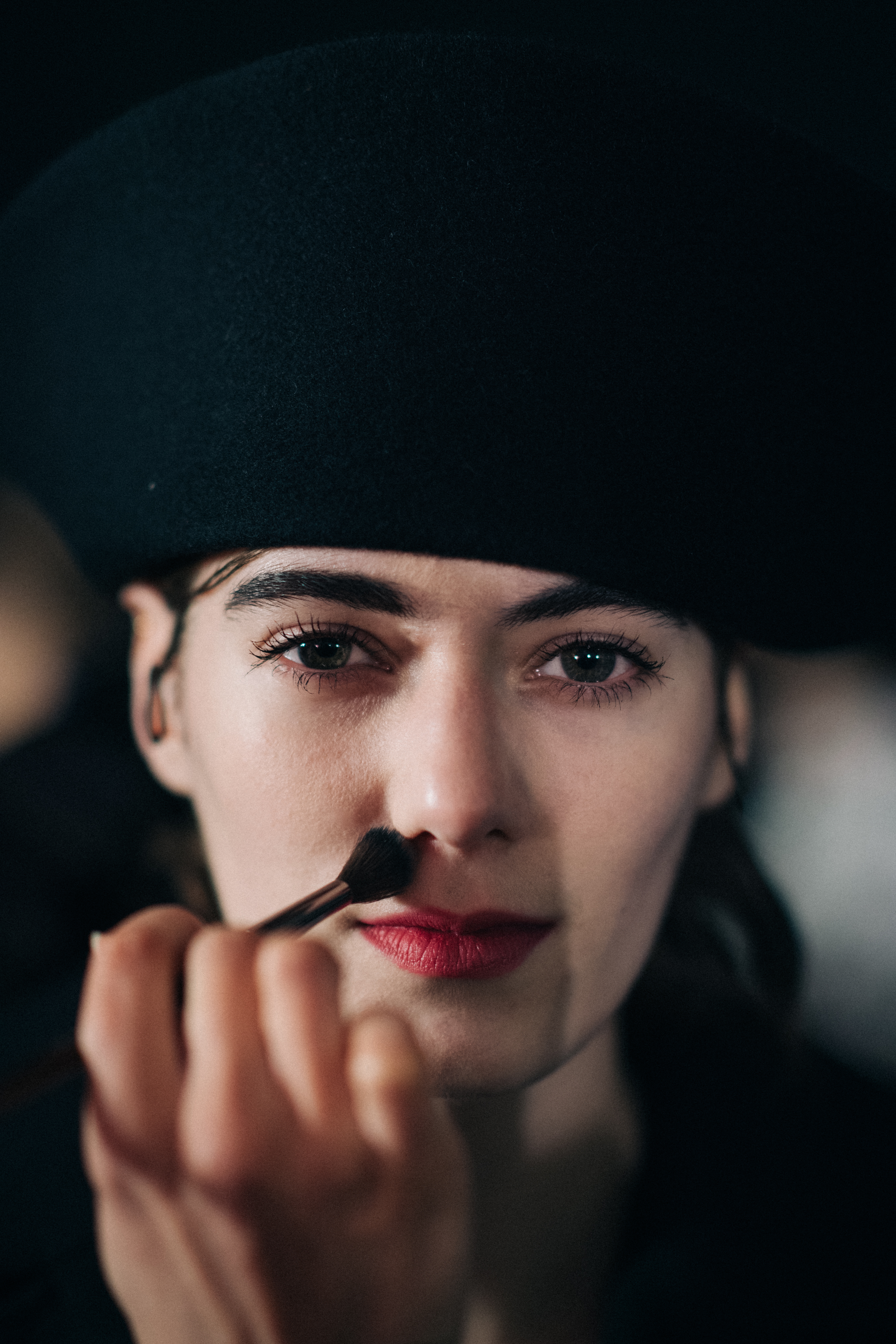 Model receiving make-up retouches