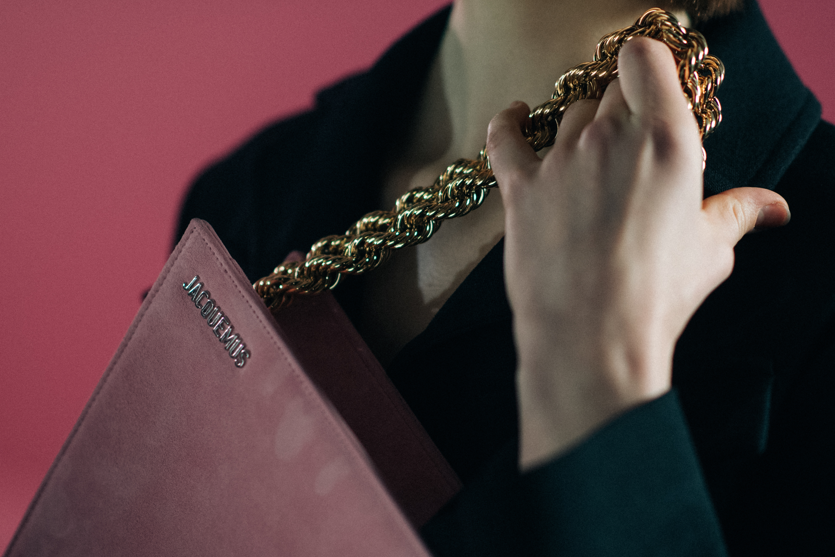 Detail of a Jacquemus suede purse