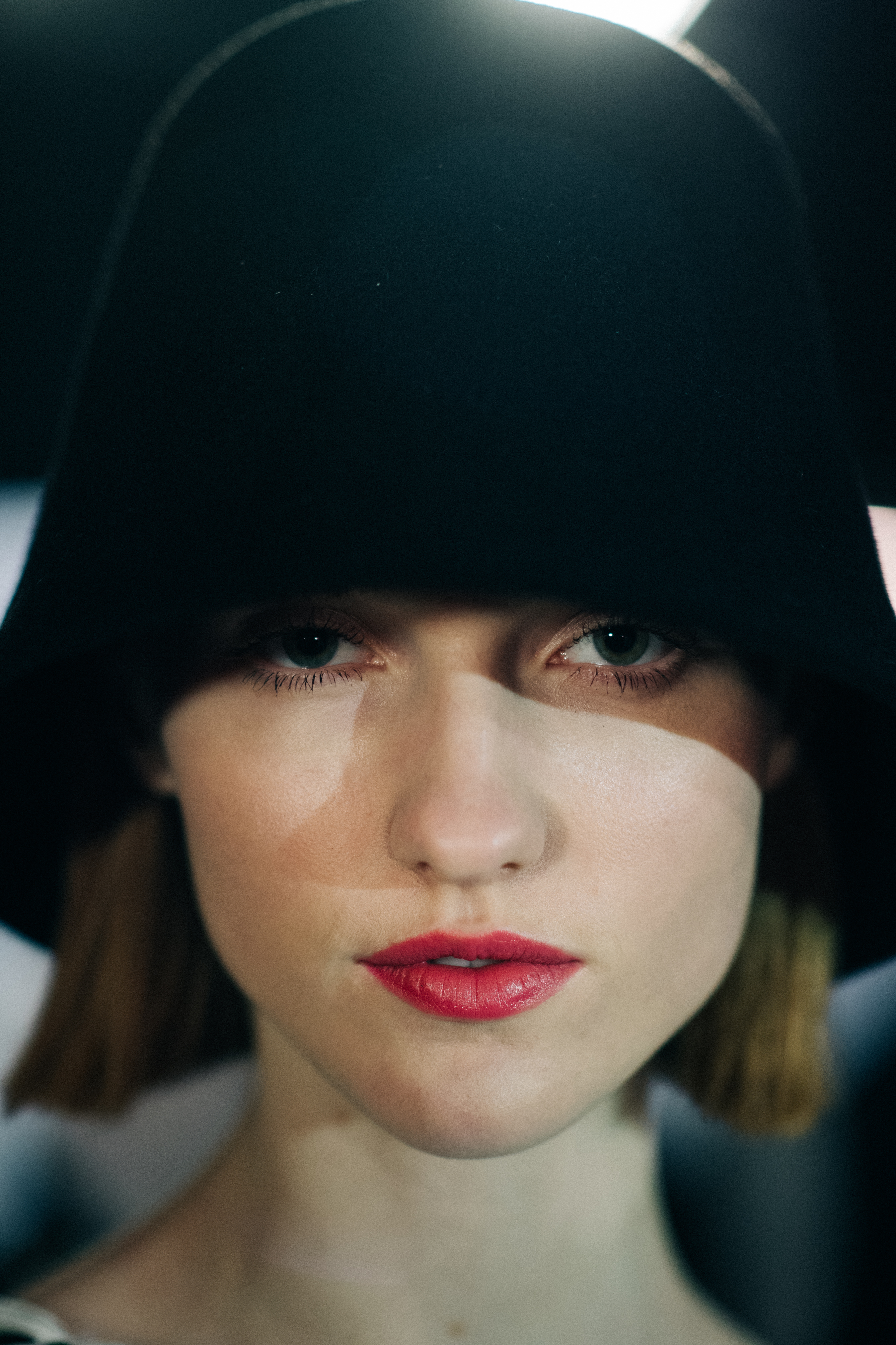 Portrait of a girl wearing a bell hat