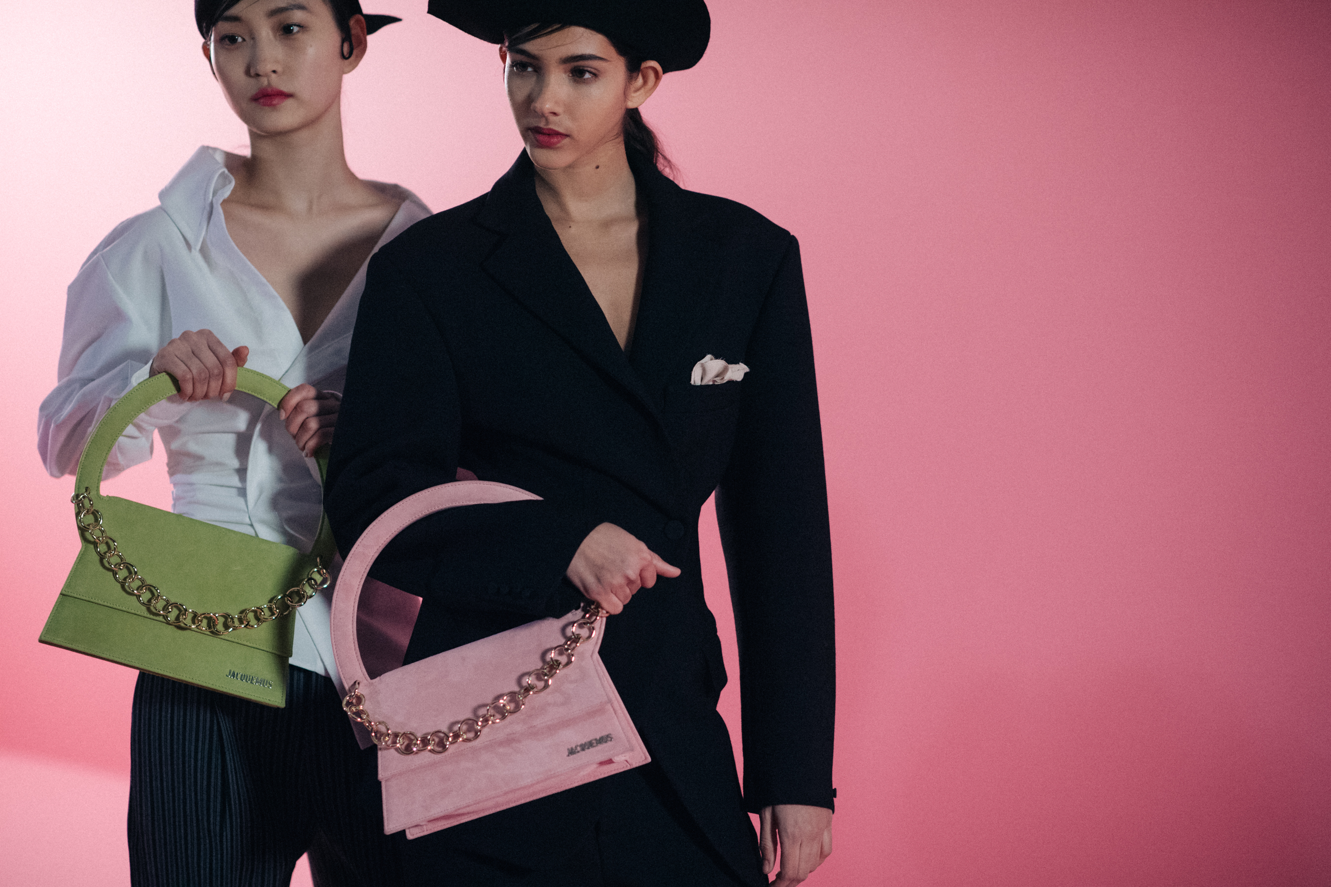 Two girls posing with Jacquemus bags