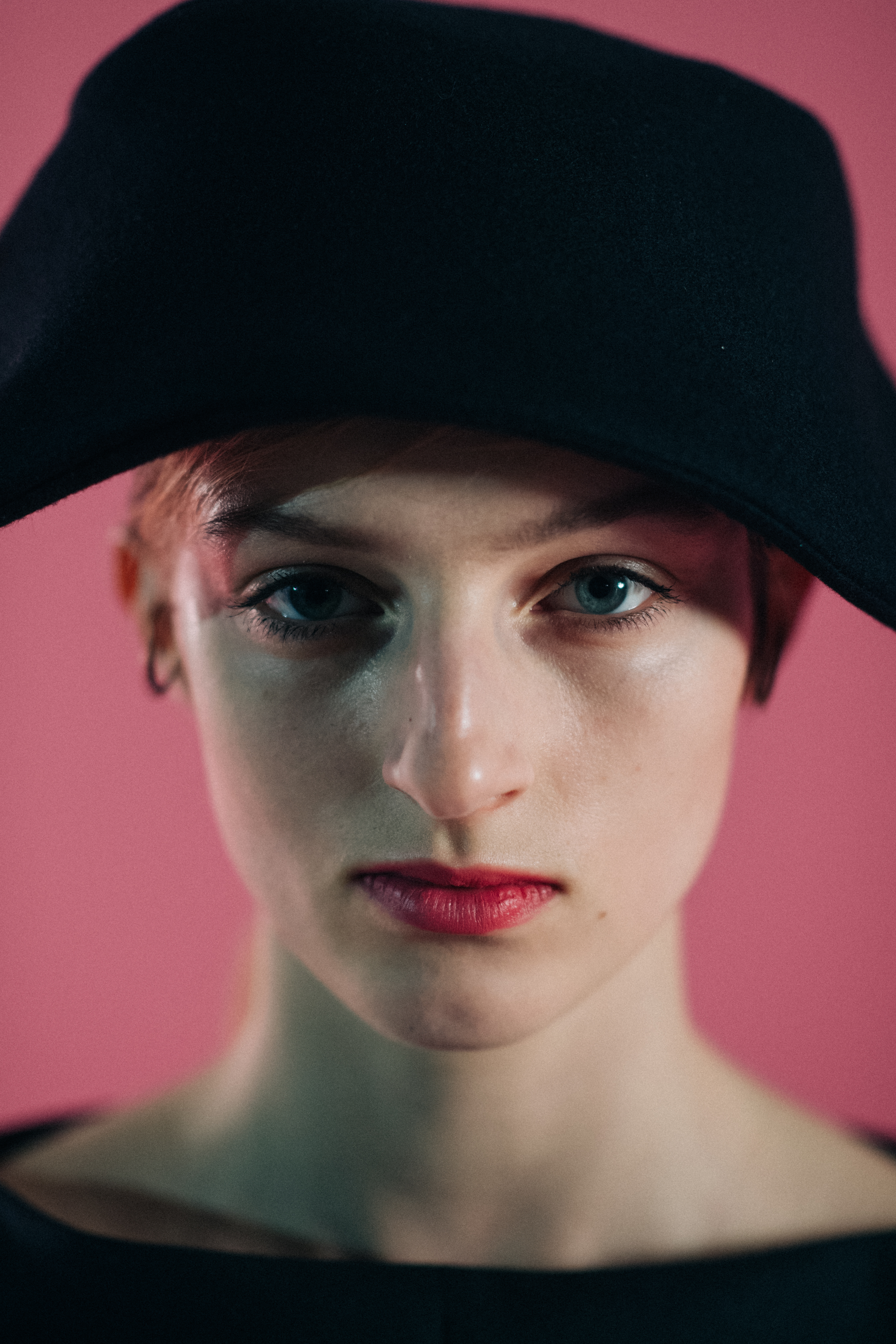 Girl wearing a black asymmetric hat