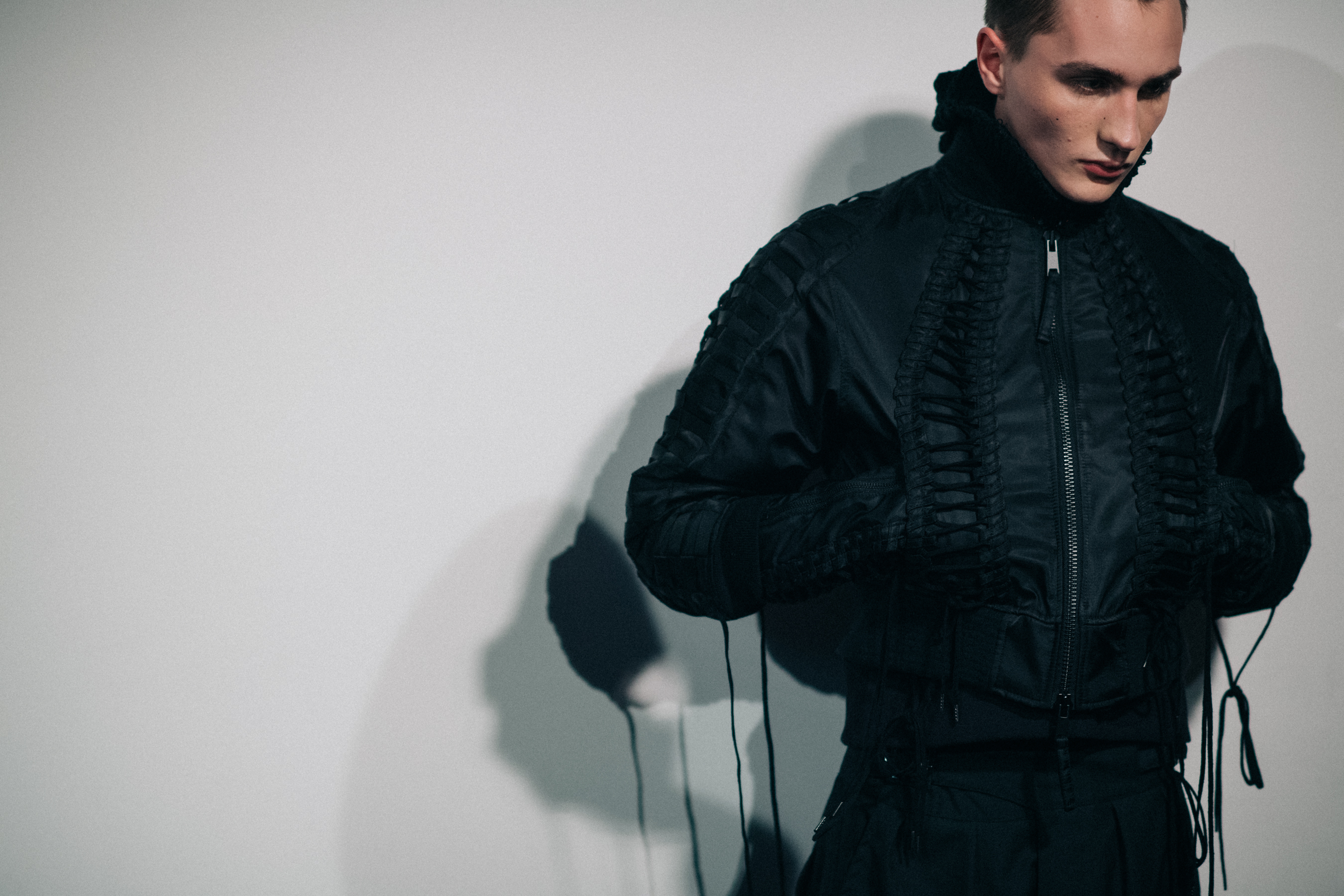 Male model wearing black bomber
