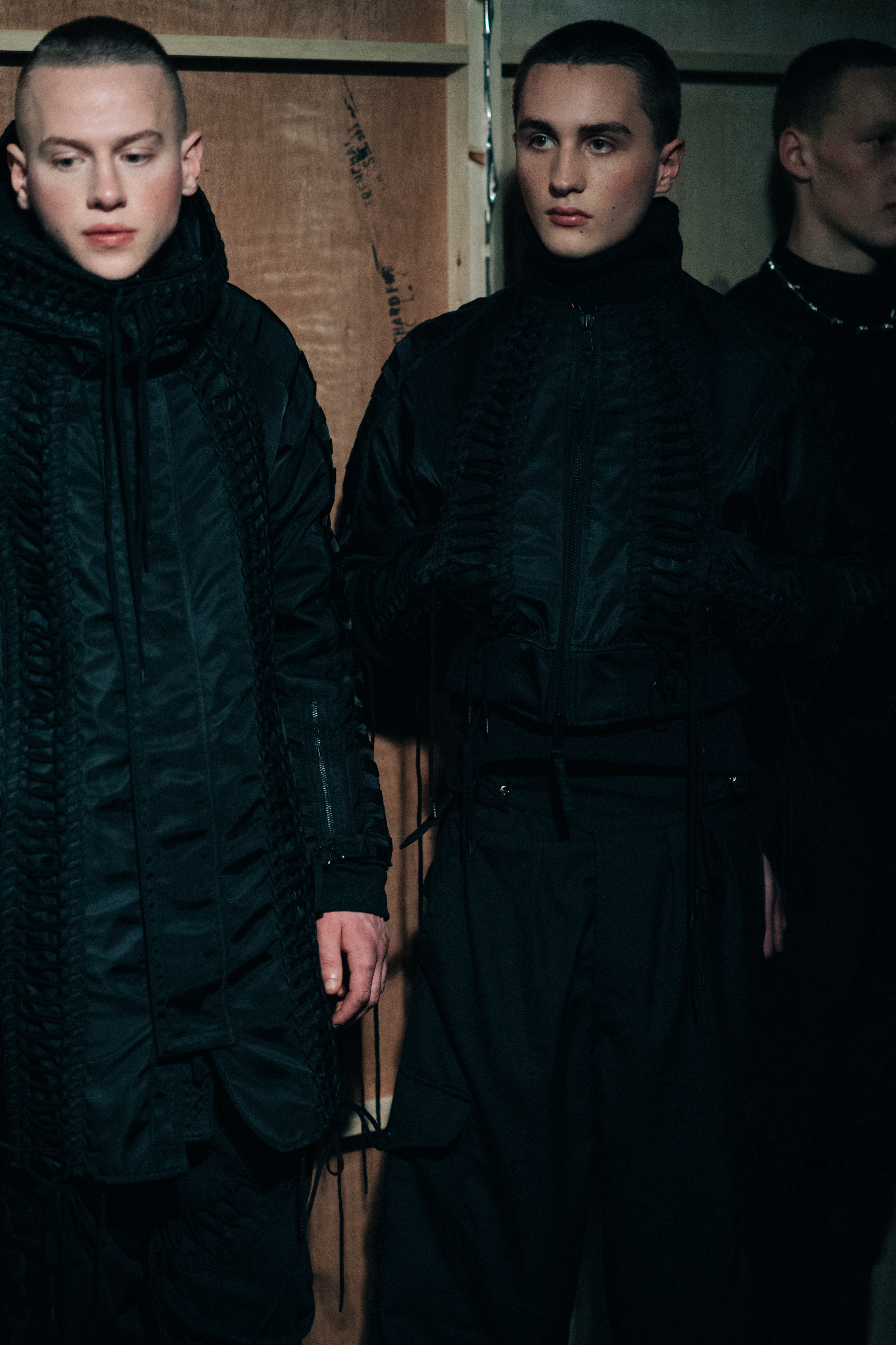 Group of male models wearing black