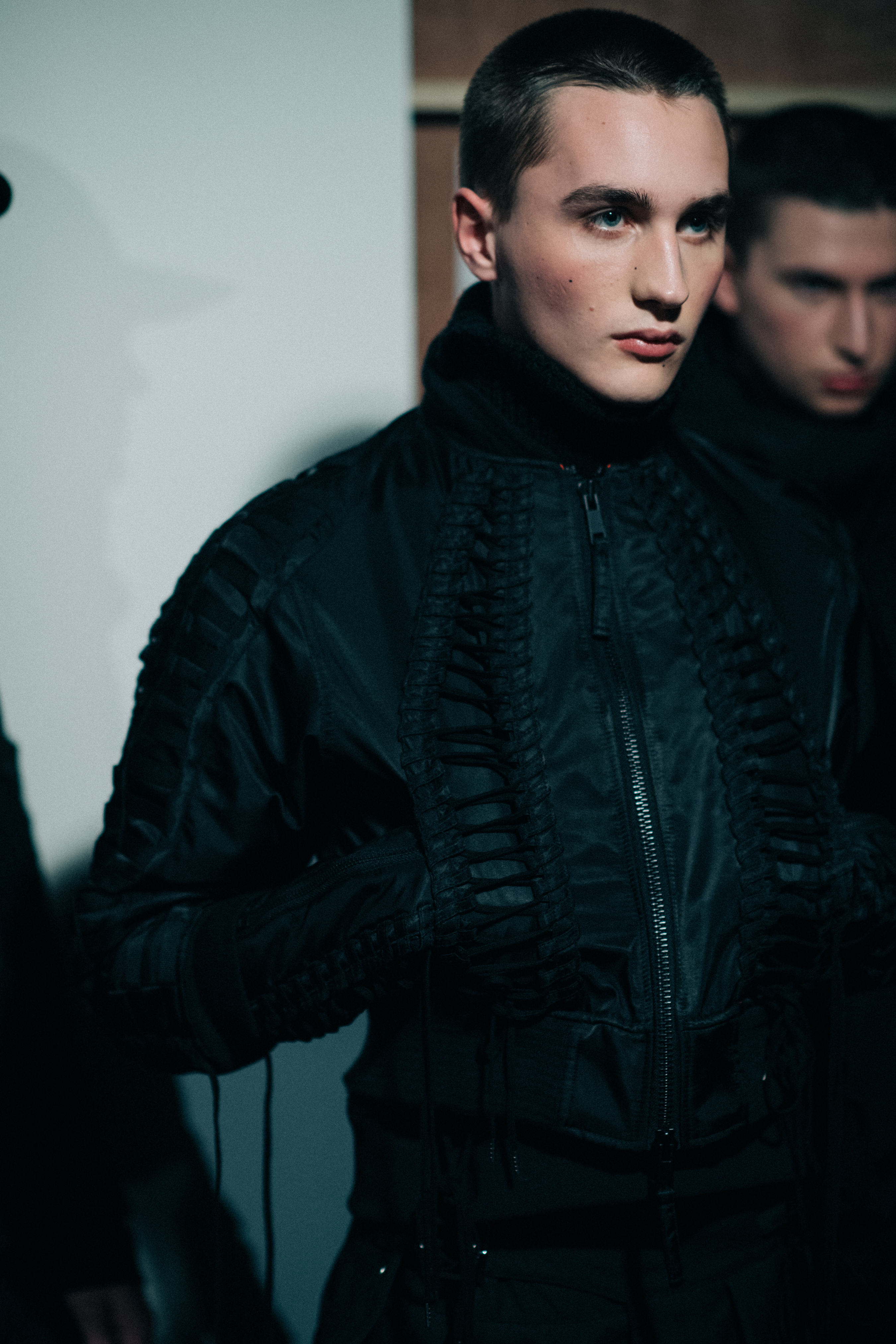 Male model wearing black jacket