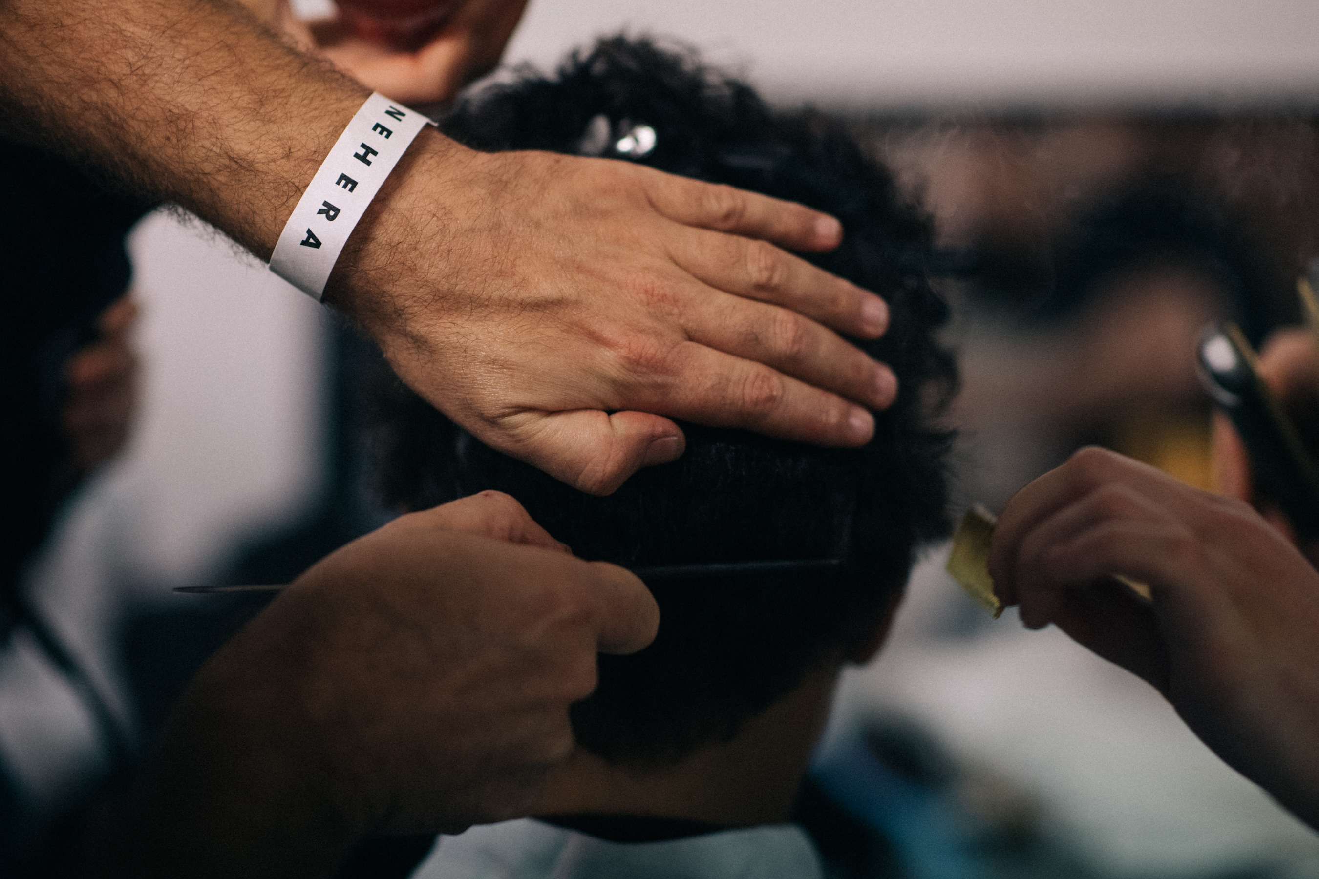 Nehera hairstylist working backstage