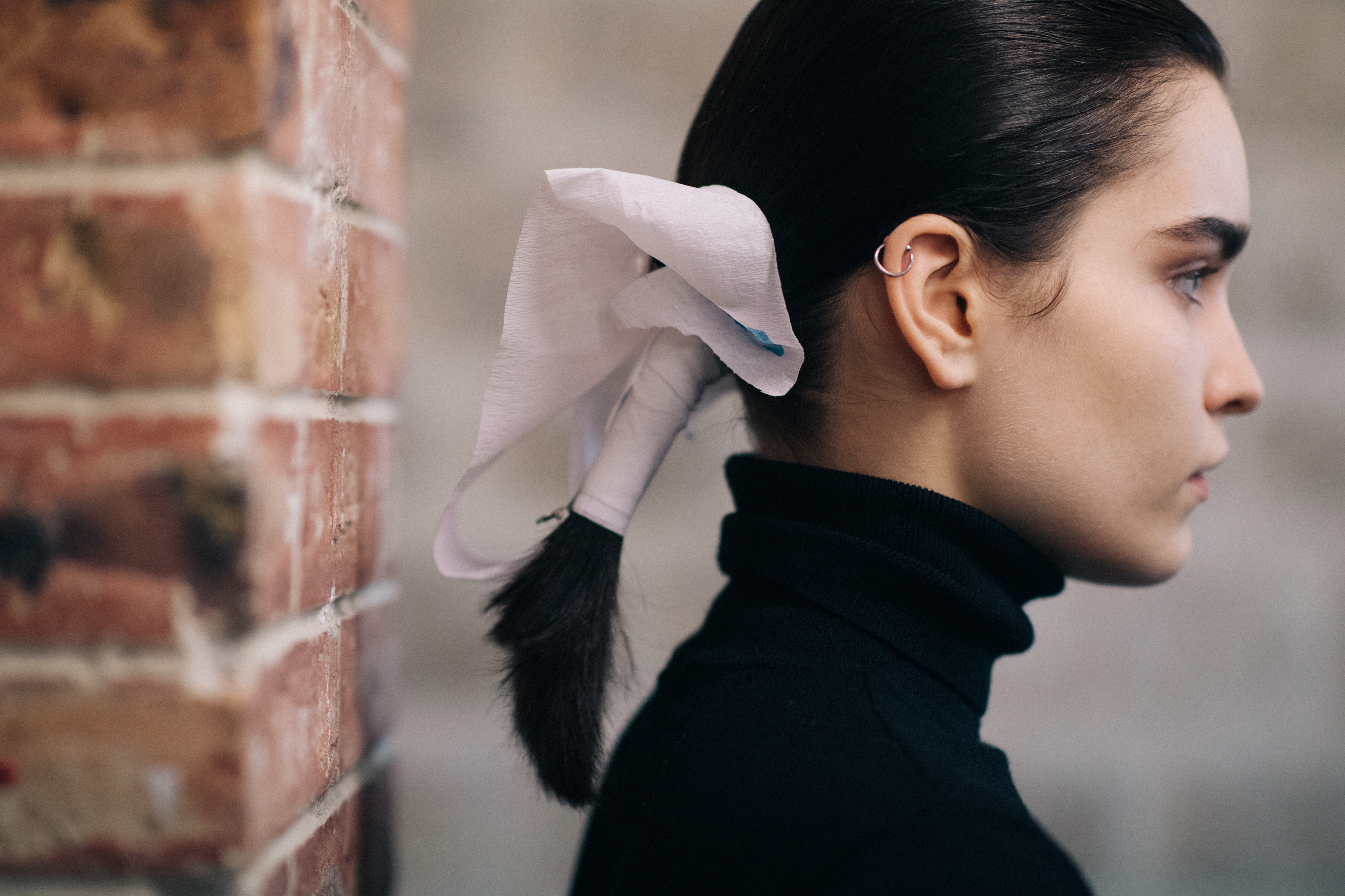 Model wearing a black turtleneck