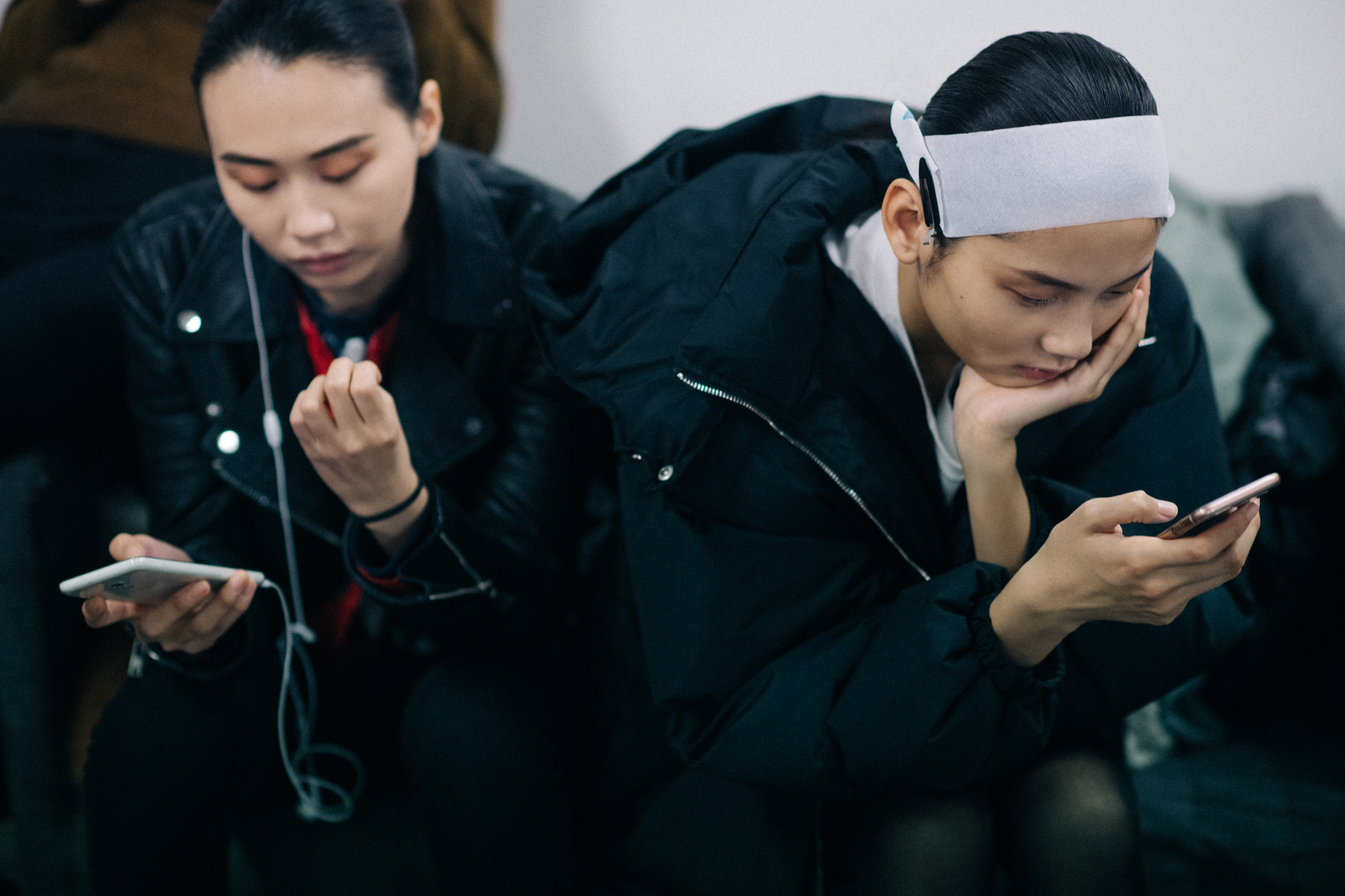 Asian models texting at Nehera backstage