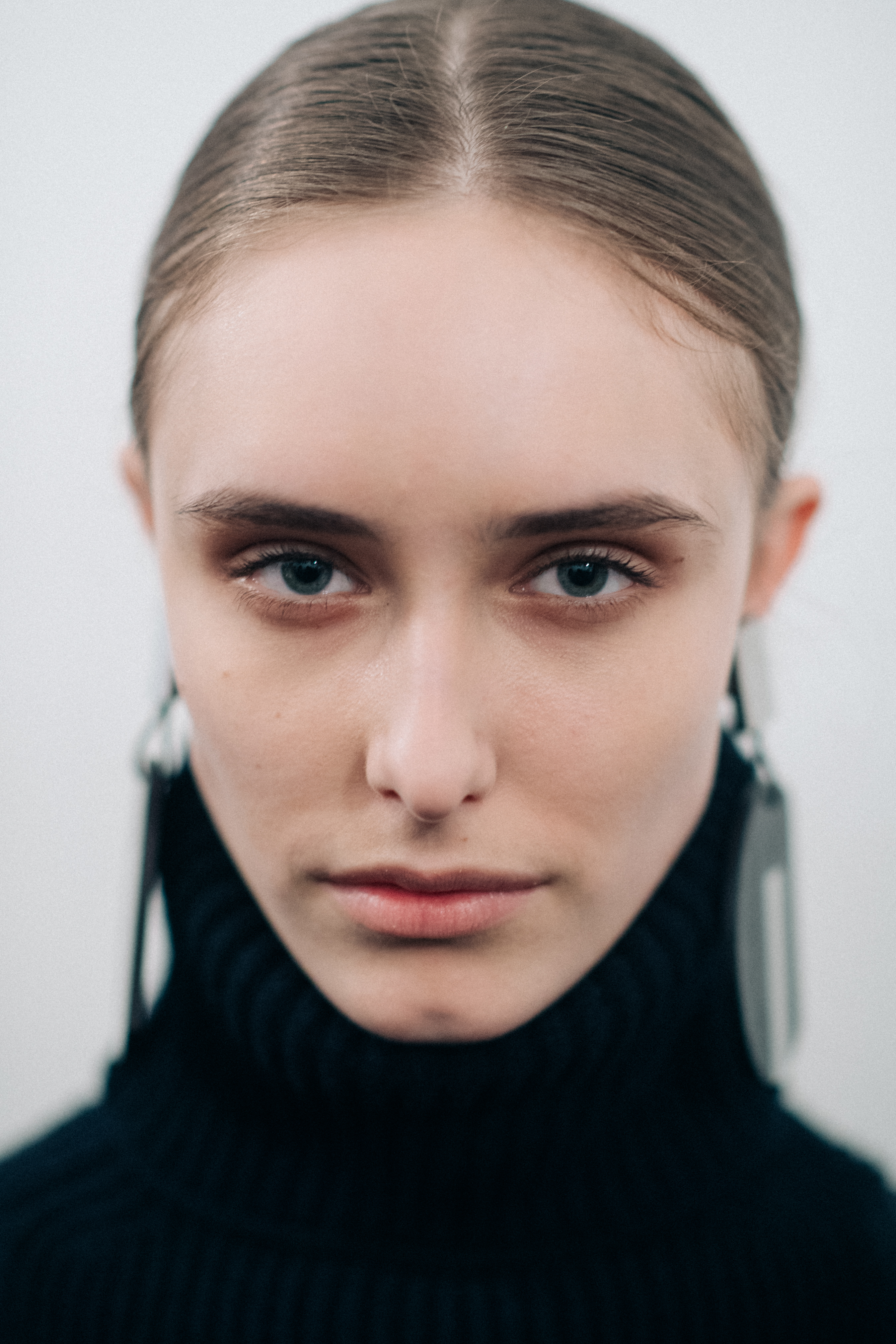 Model wearing a black wool turtleneck