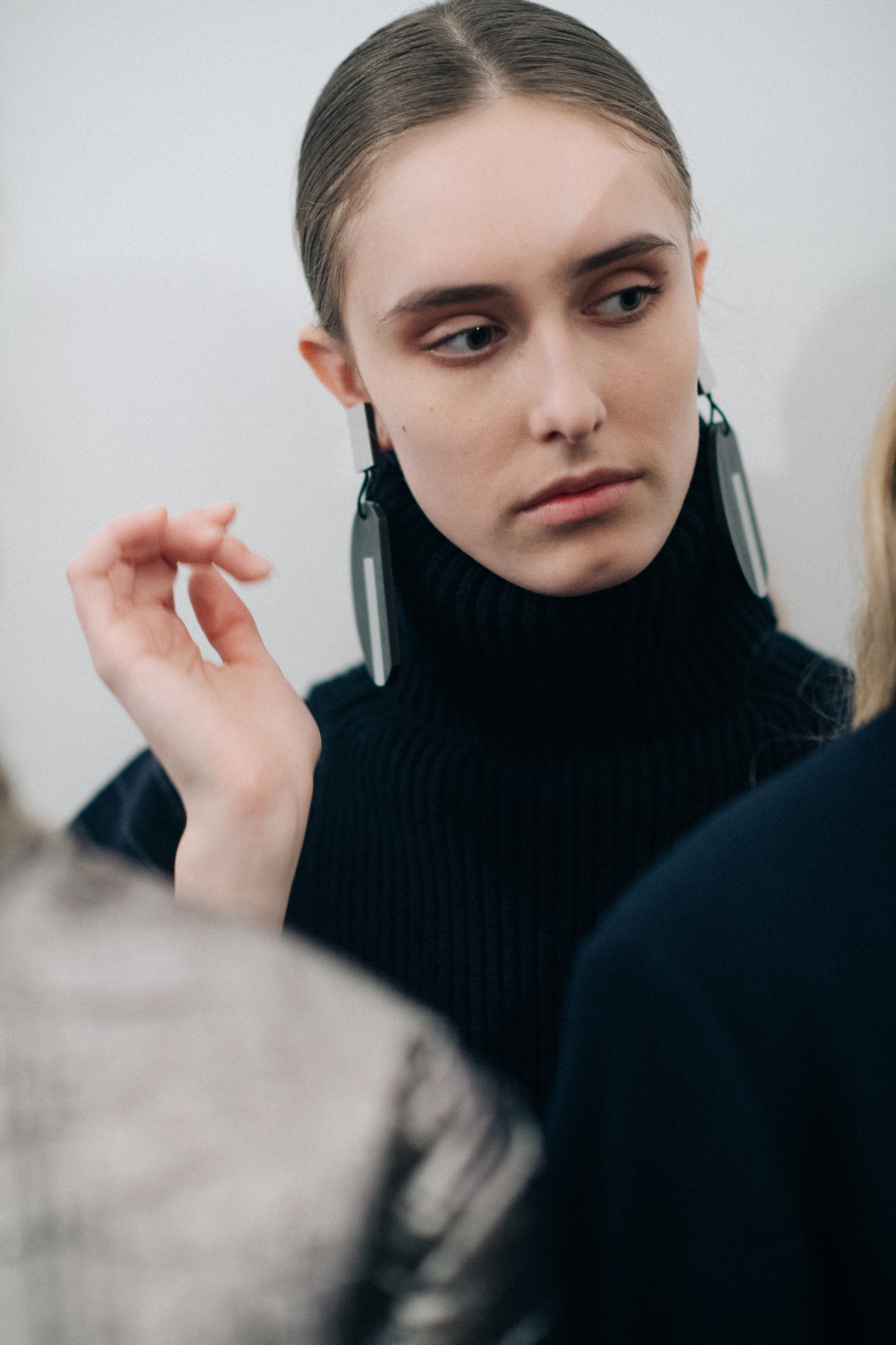 Model wearing a black turtleneck