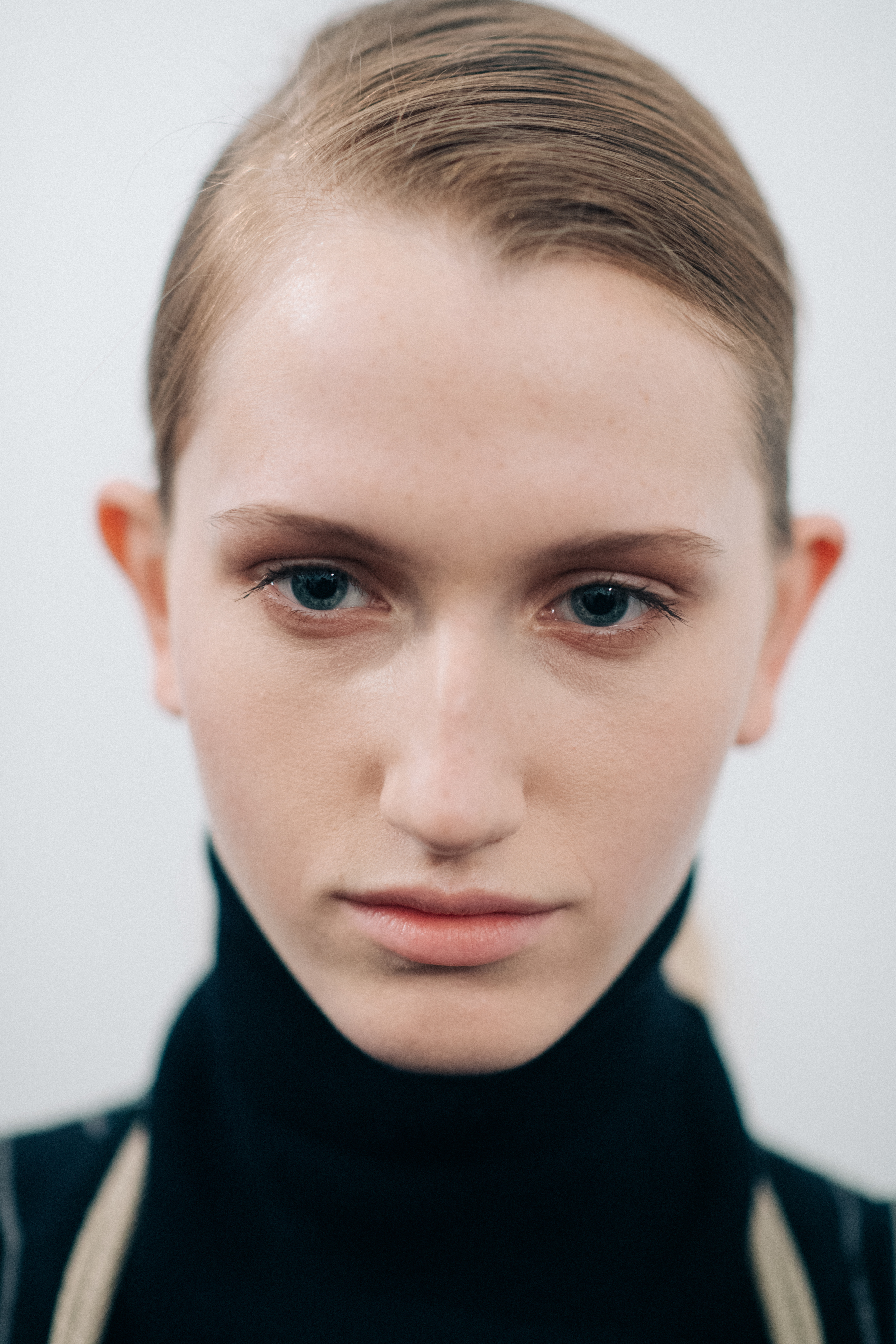 Model wearing a black wool turtleneck