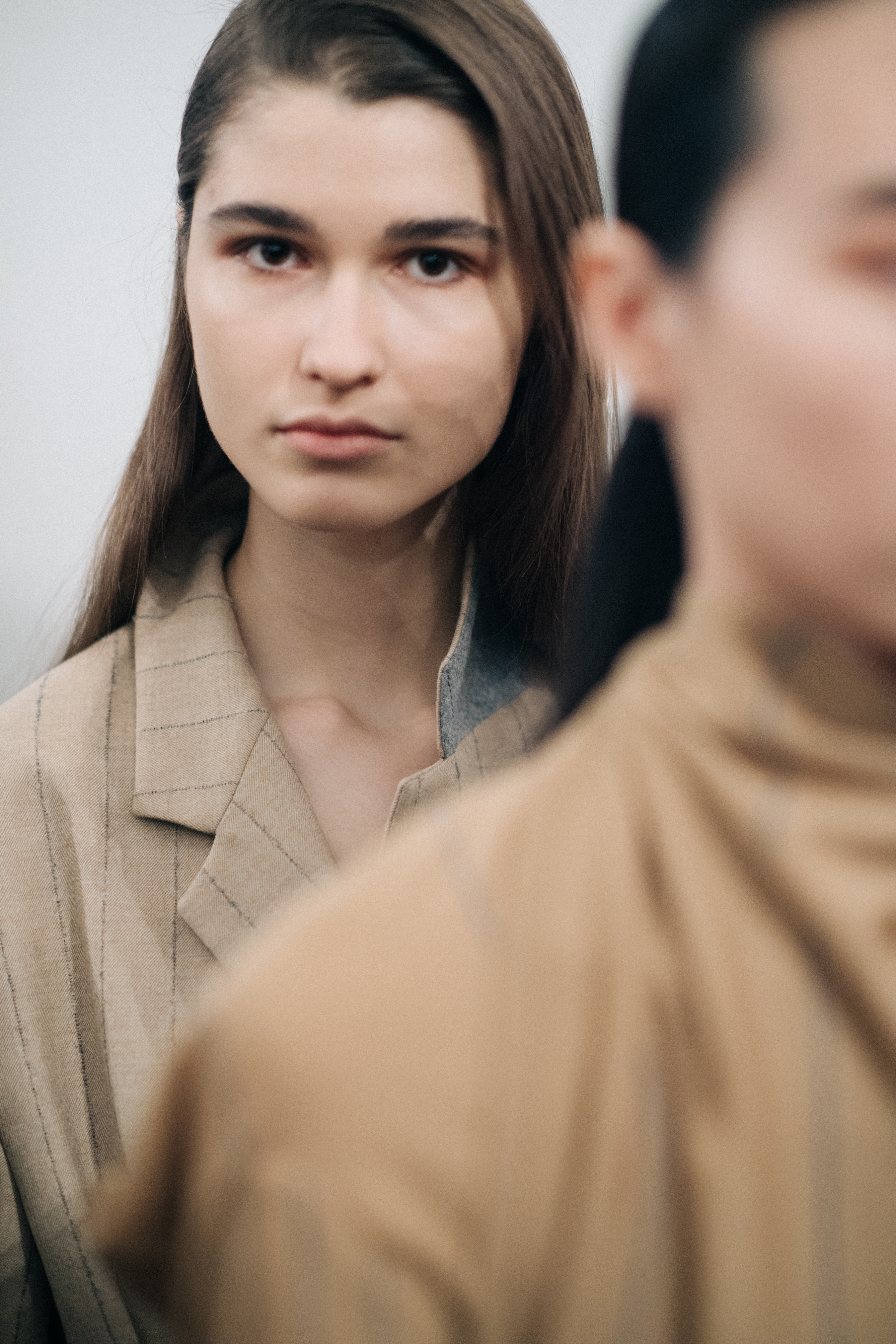 Model wearing a striped Nehera jacket
