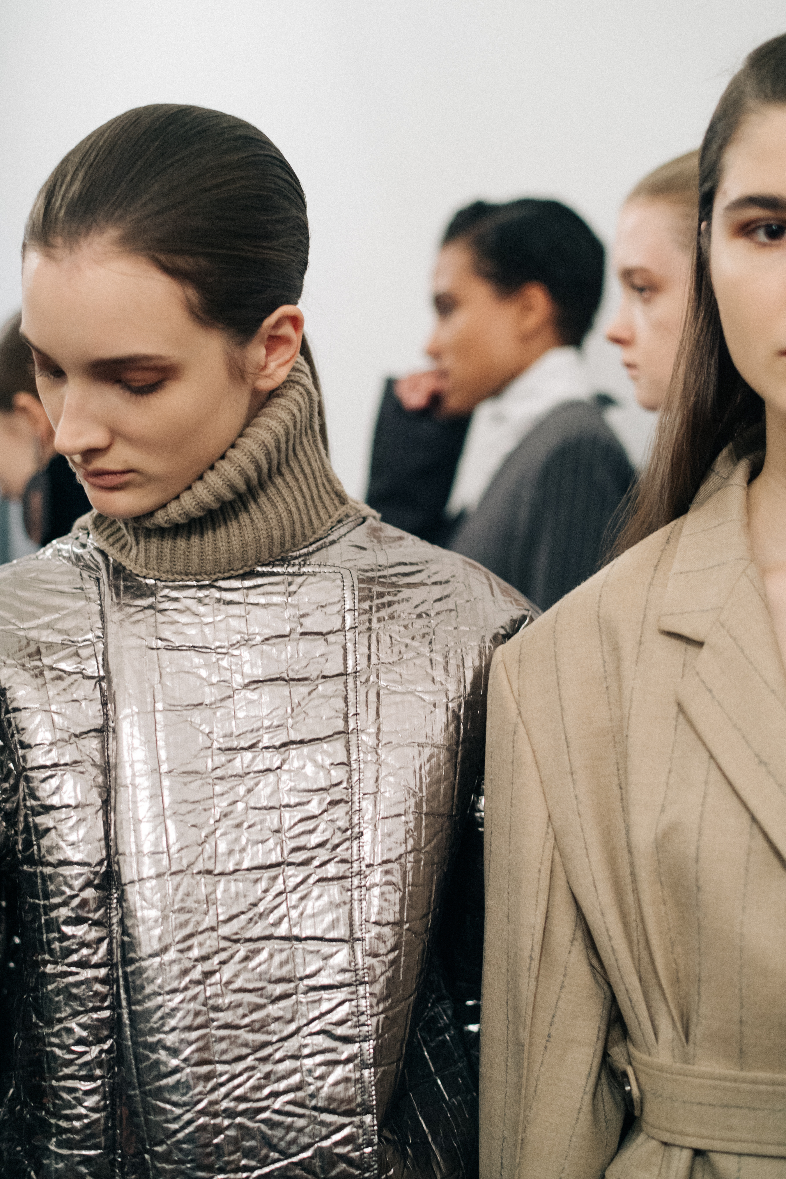 Model wearing a metallic turtleneck