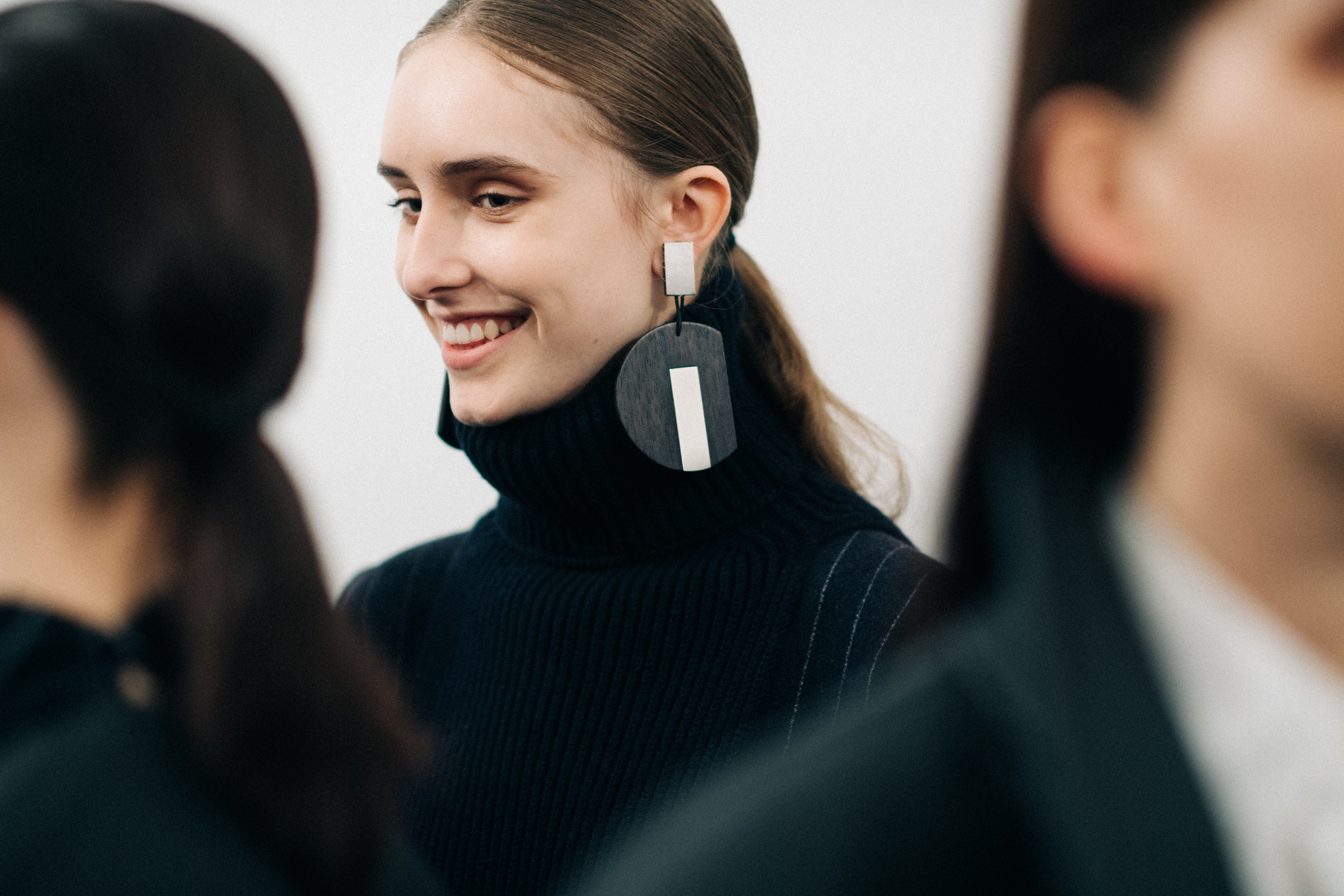 Model wearing a black wool turtleneck