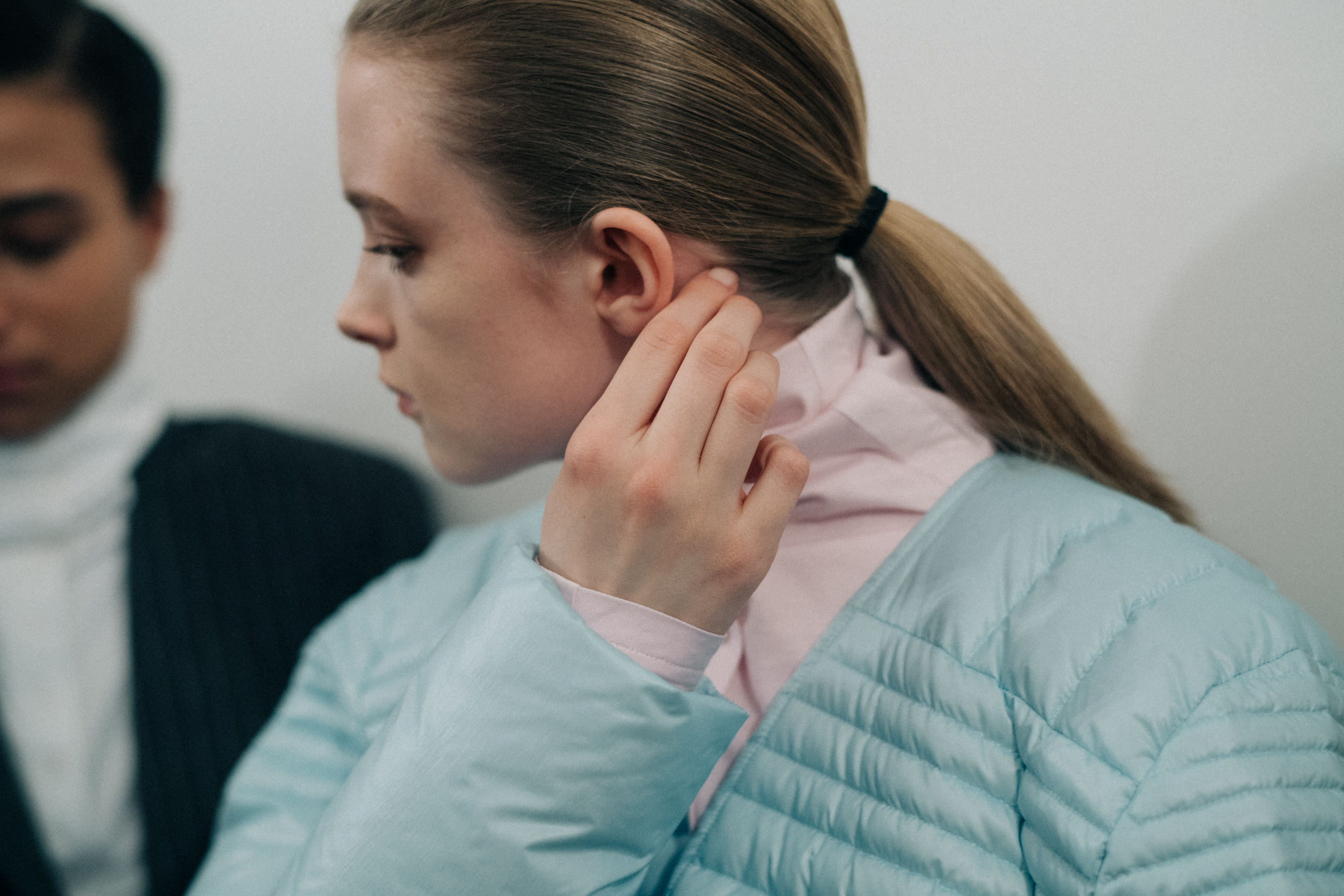 Model wearing a blue puff jacket