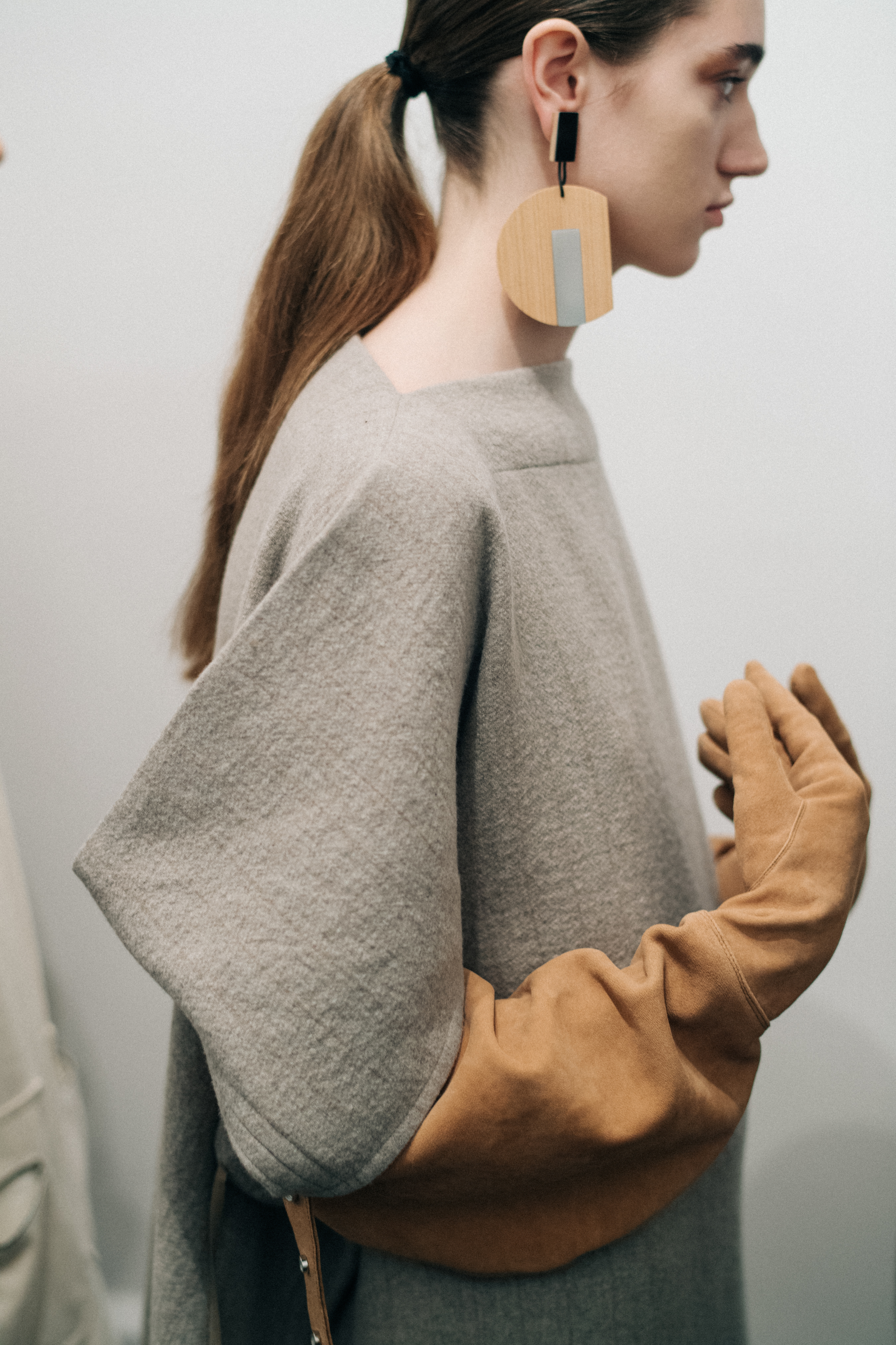 Model wearing suede oversized glvoes